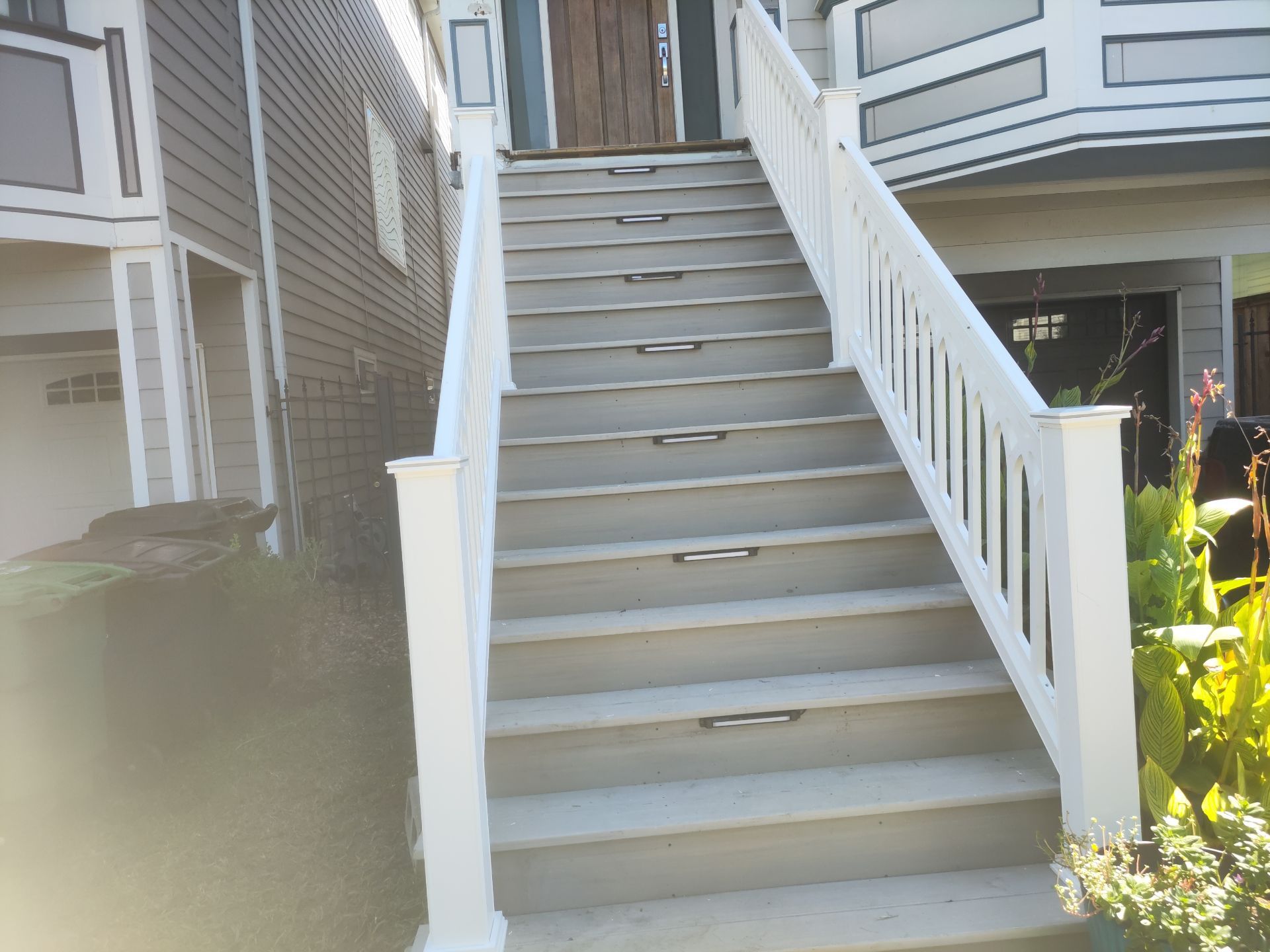 Timbertech Staircase with a 50 year warranty and solar lighting by Majesty Construction