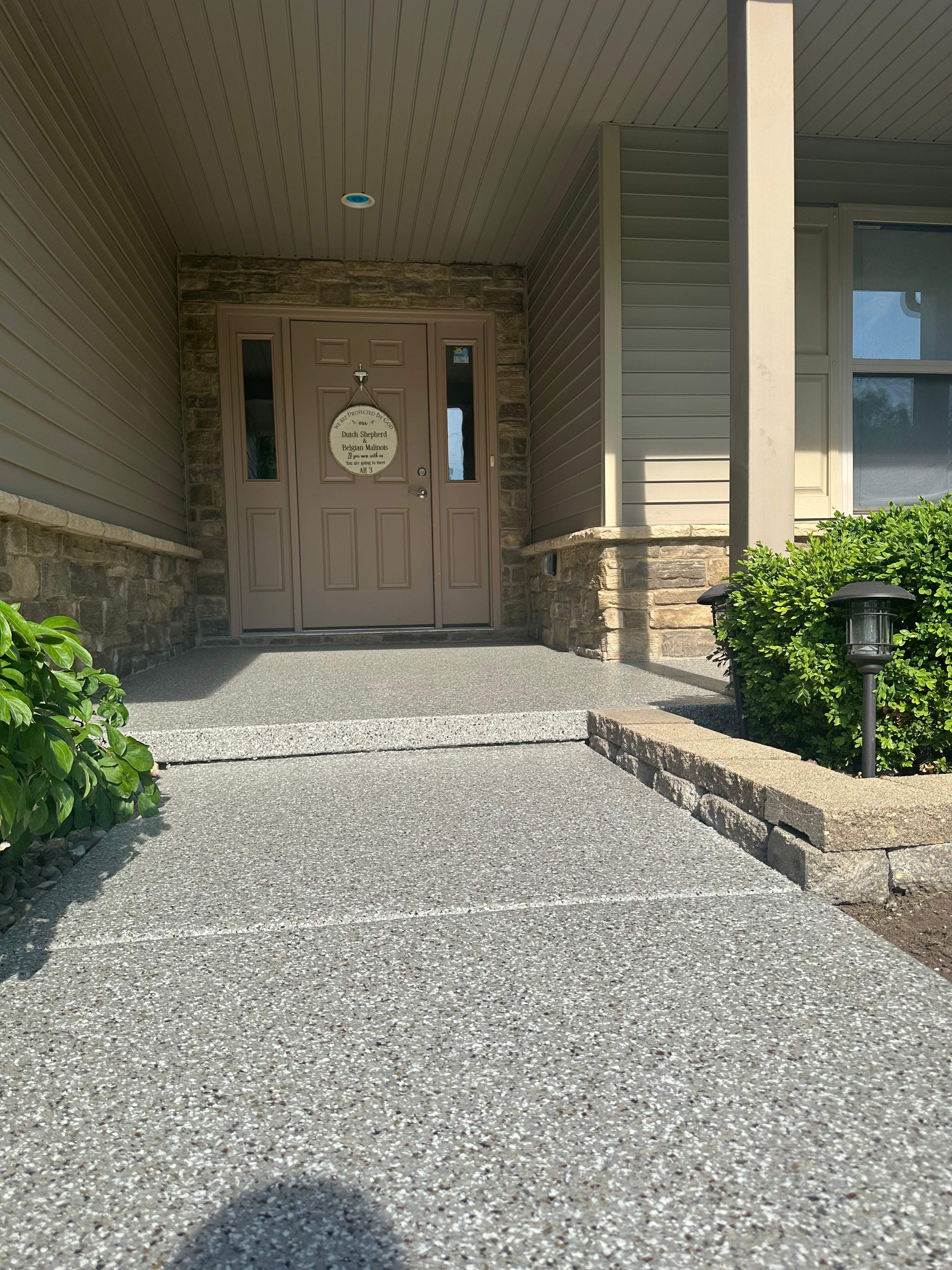Creekbed Back Patio  by Level 10 Coatings