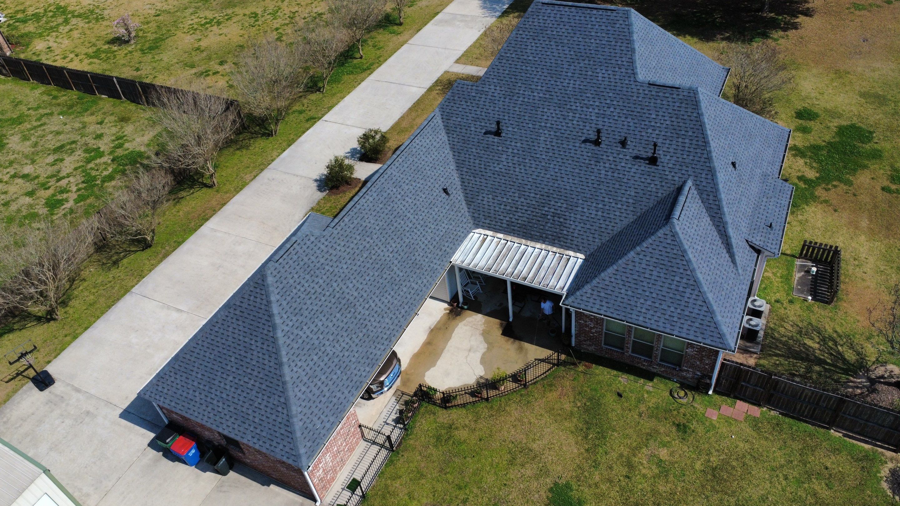 Residential roof installation in Plaquemine, LA using Atlas Pinnacle Pristine Pewter shingles  by Top Team Roofing & Construction