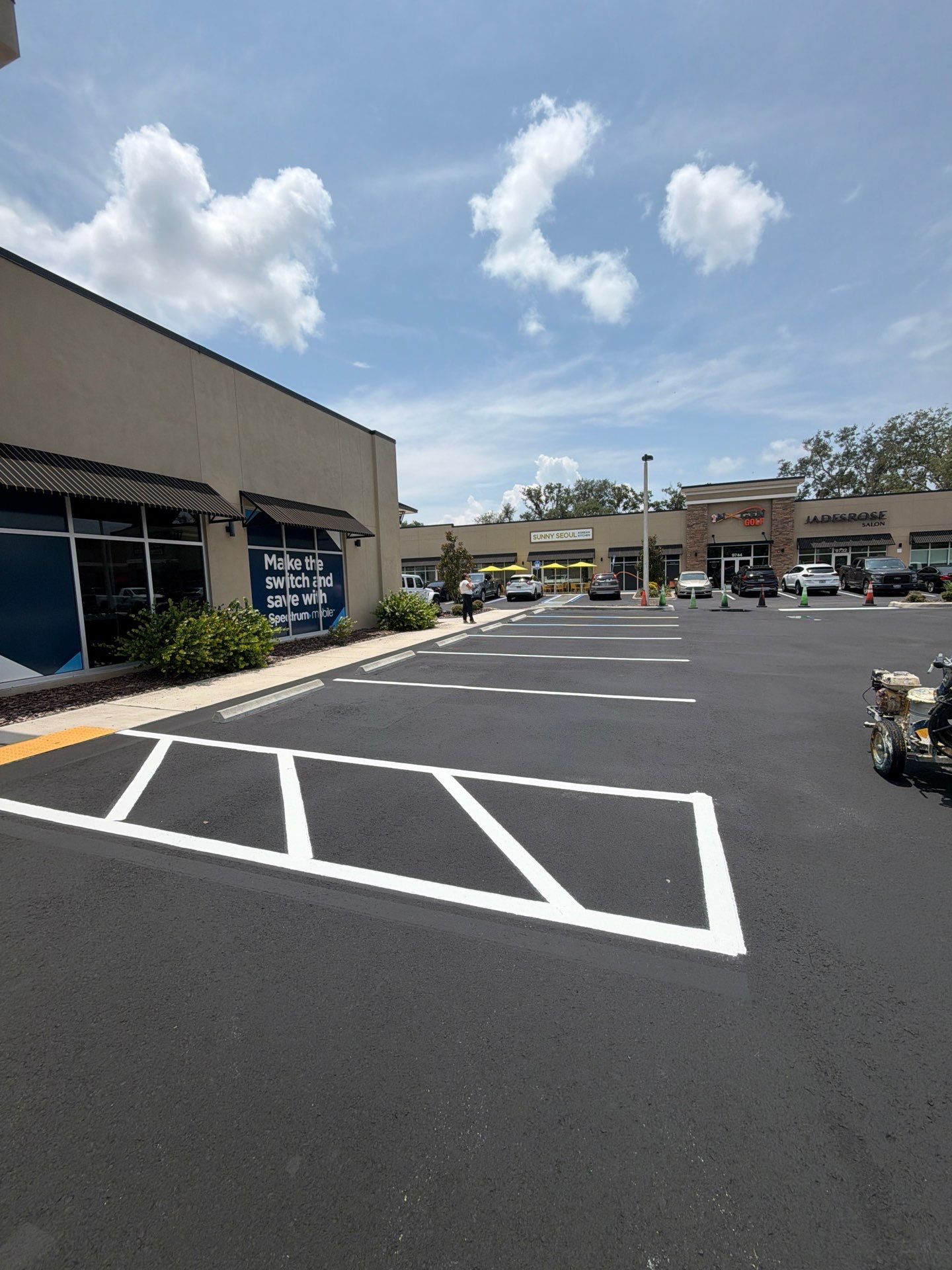 Commercial Asphalt Sealcoating and Line Striping at School House Plaza by Everline Coatings & Services - Southwest FL