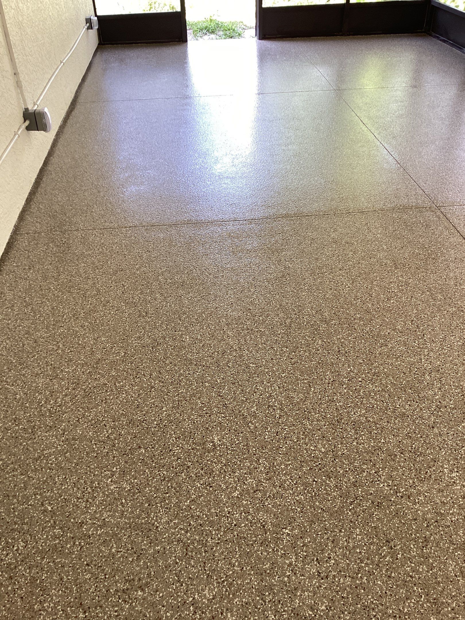 Patio using Pebble Beach by Amvet concrete coatings llc