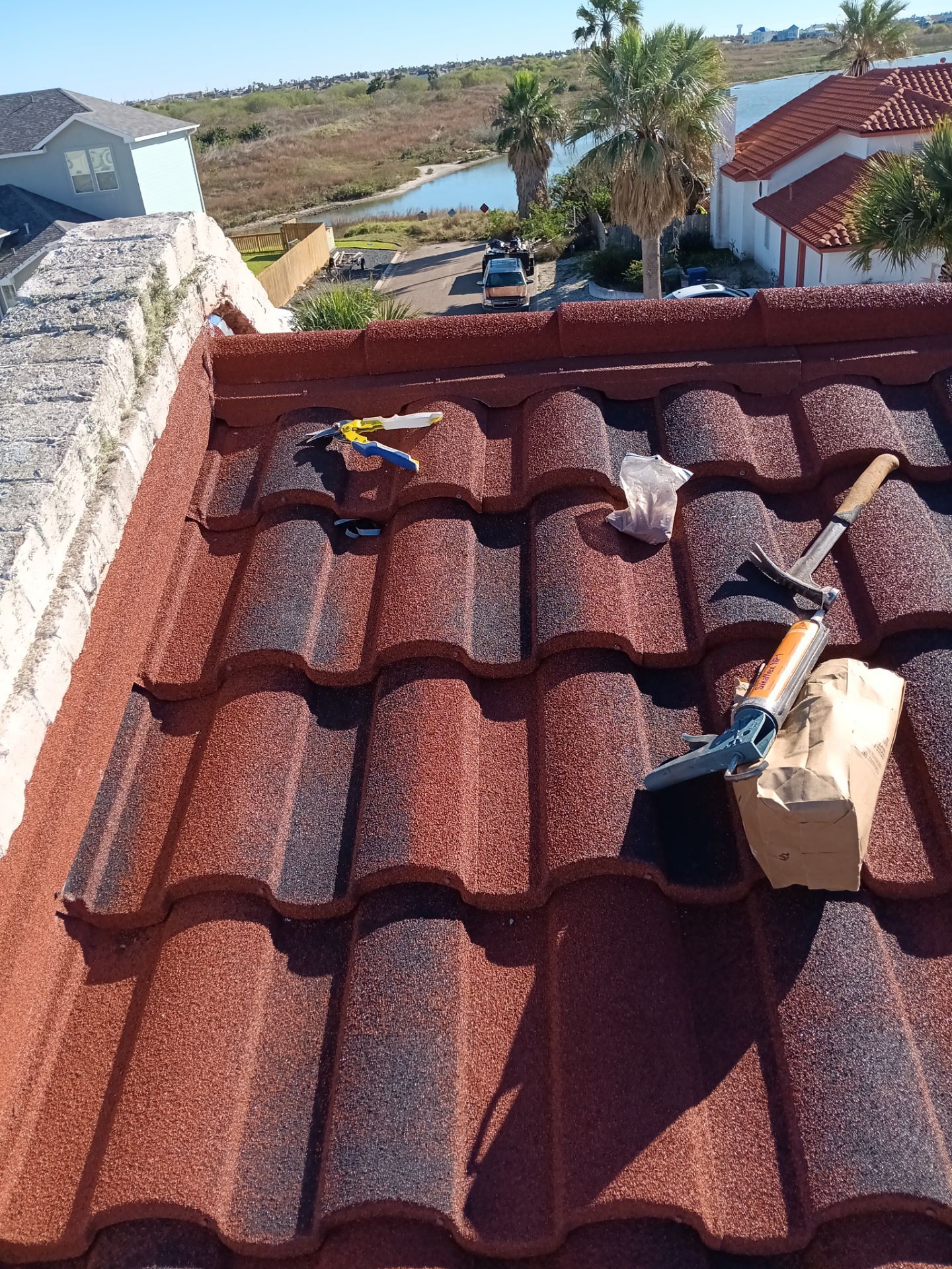 Off with the Tile and on with the TILCOR stone coated metal.  by Bayfront Roofing and Construction