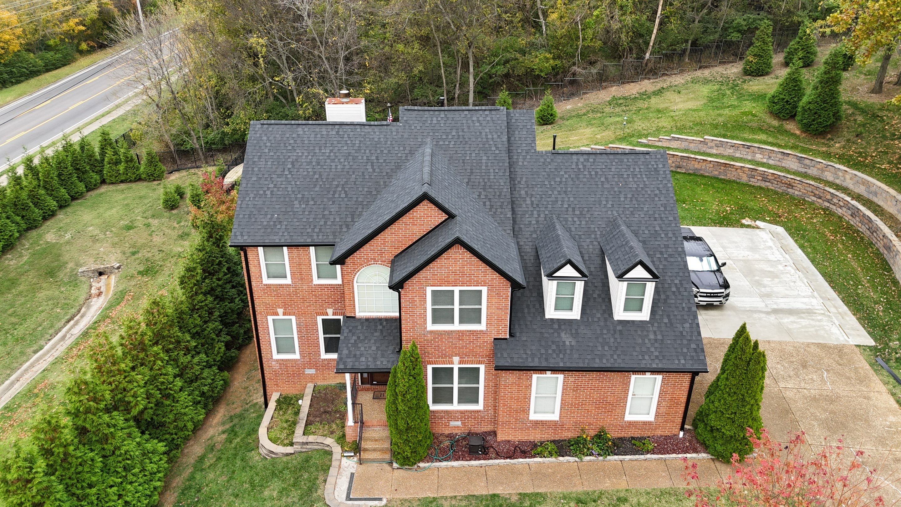Charcoal Black Re-Roof & Gutters by Royal House LLC