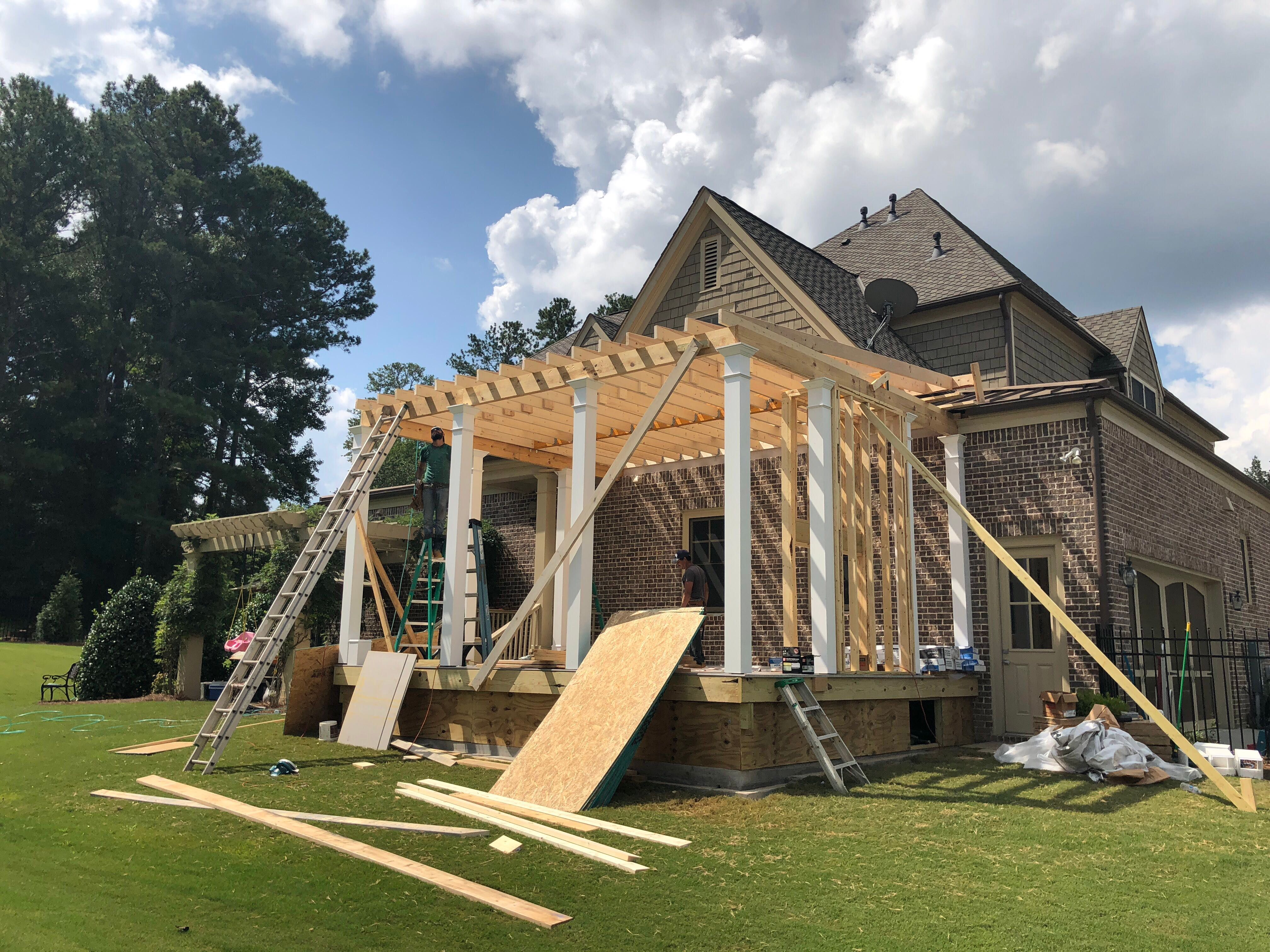 Custom Screened Porch Addition with White Brick Fireplace in Duluth by Swift Home Renovations
