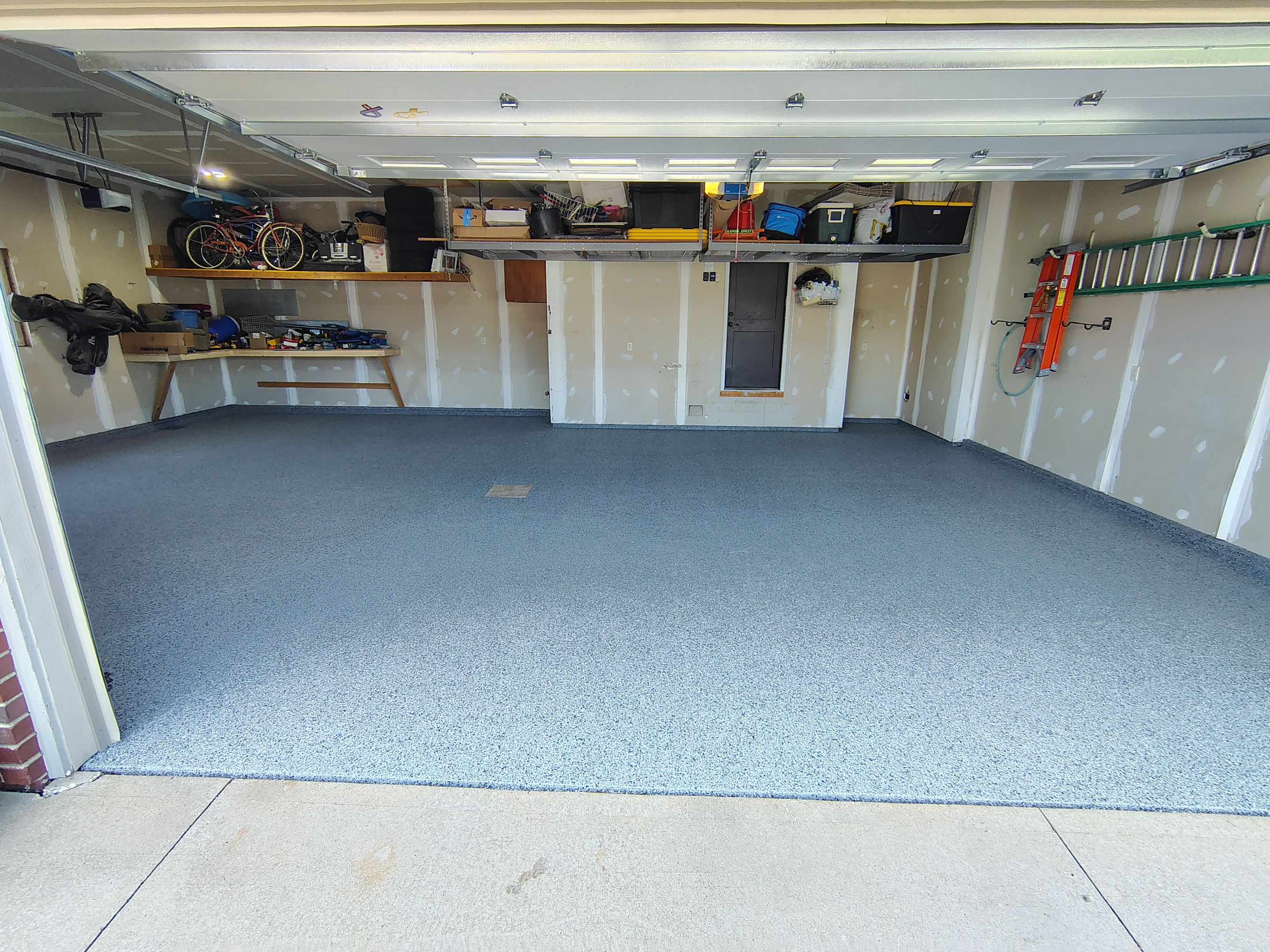 Sioux Falls Garage Concrete Grinding and Nightfall Decorative Chip Coating by Select Painting, Coatings & Garage Cabinets