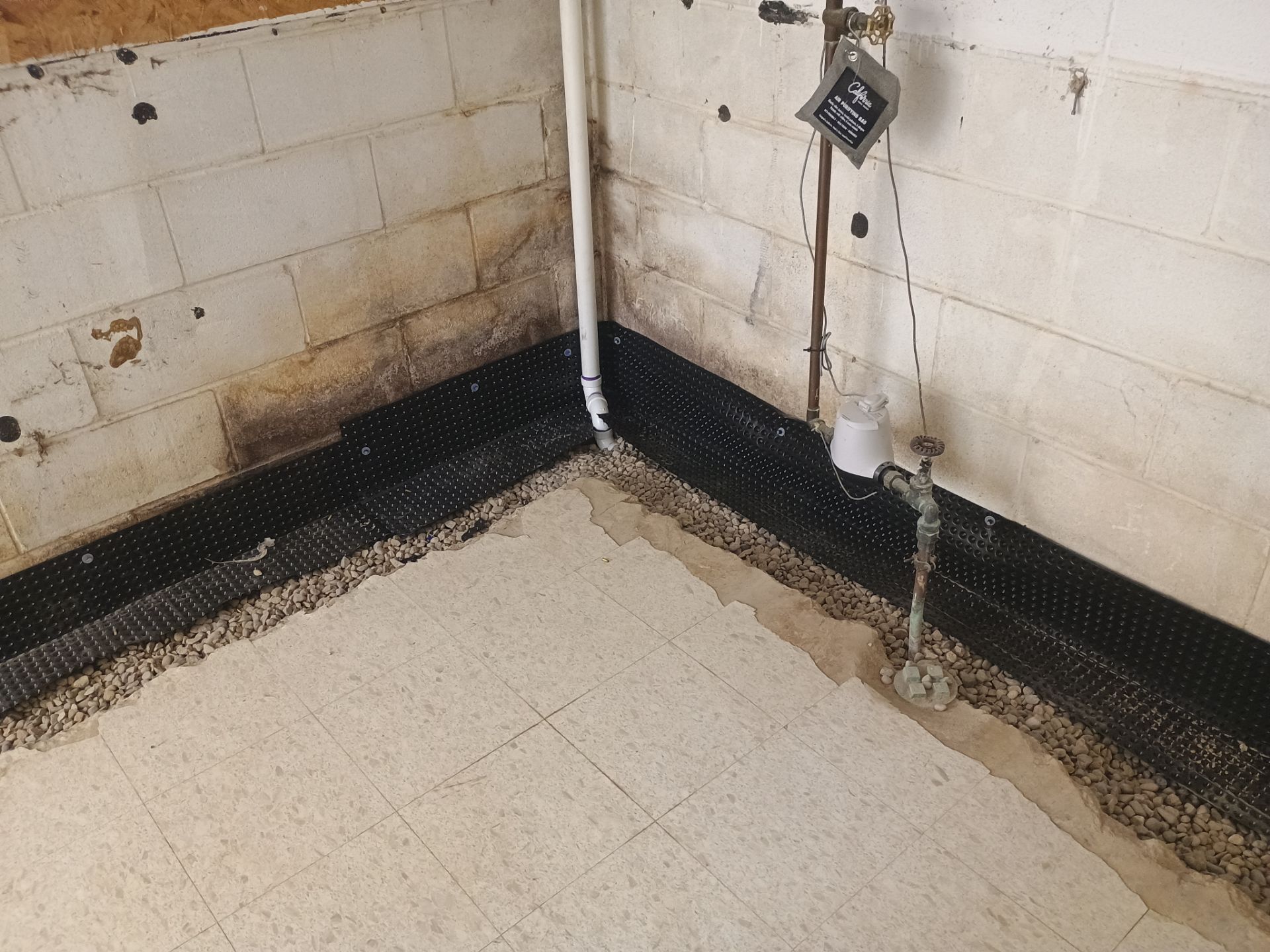 Interior Drain Tile Installation in Columbia Heights, MN by Waterproofing Northeast