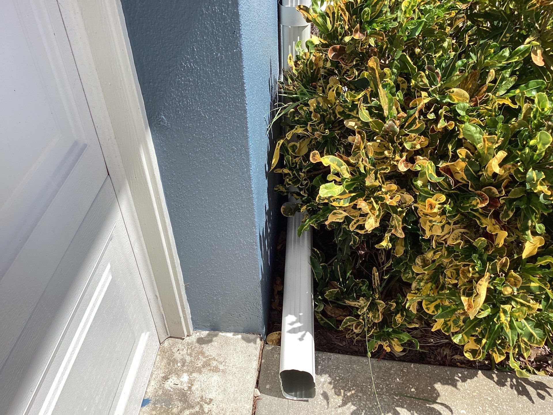 White Downspouts and Gutters Combo in Punta Gorda FL by Gutter Professors