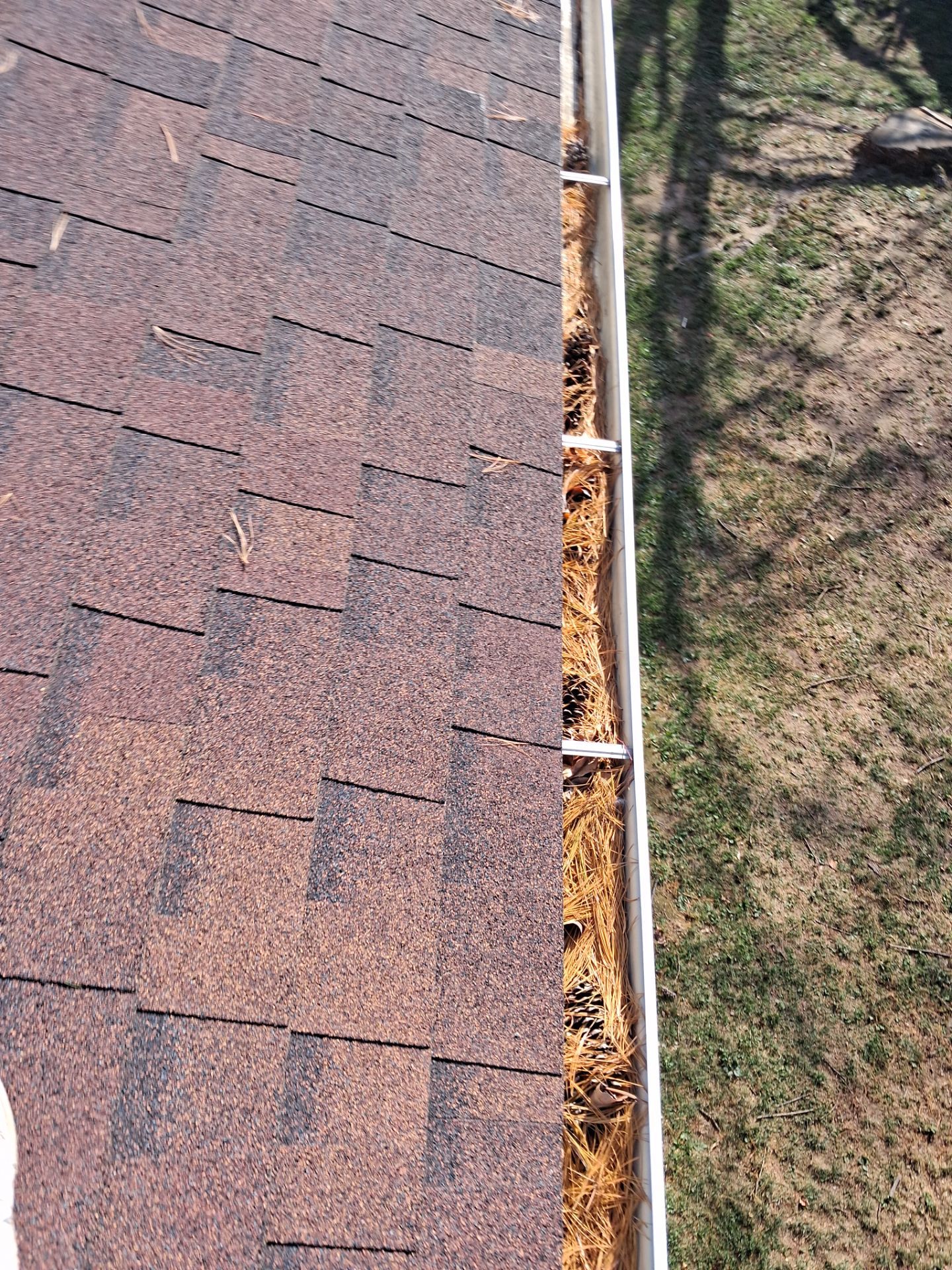 Commercial gutter cleaning Evansville, IN before photo with filled gutters