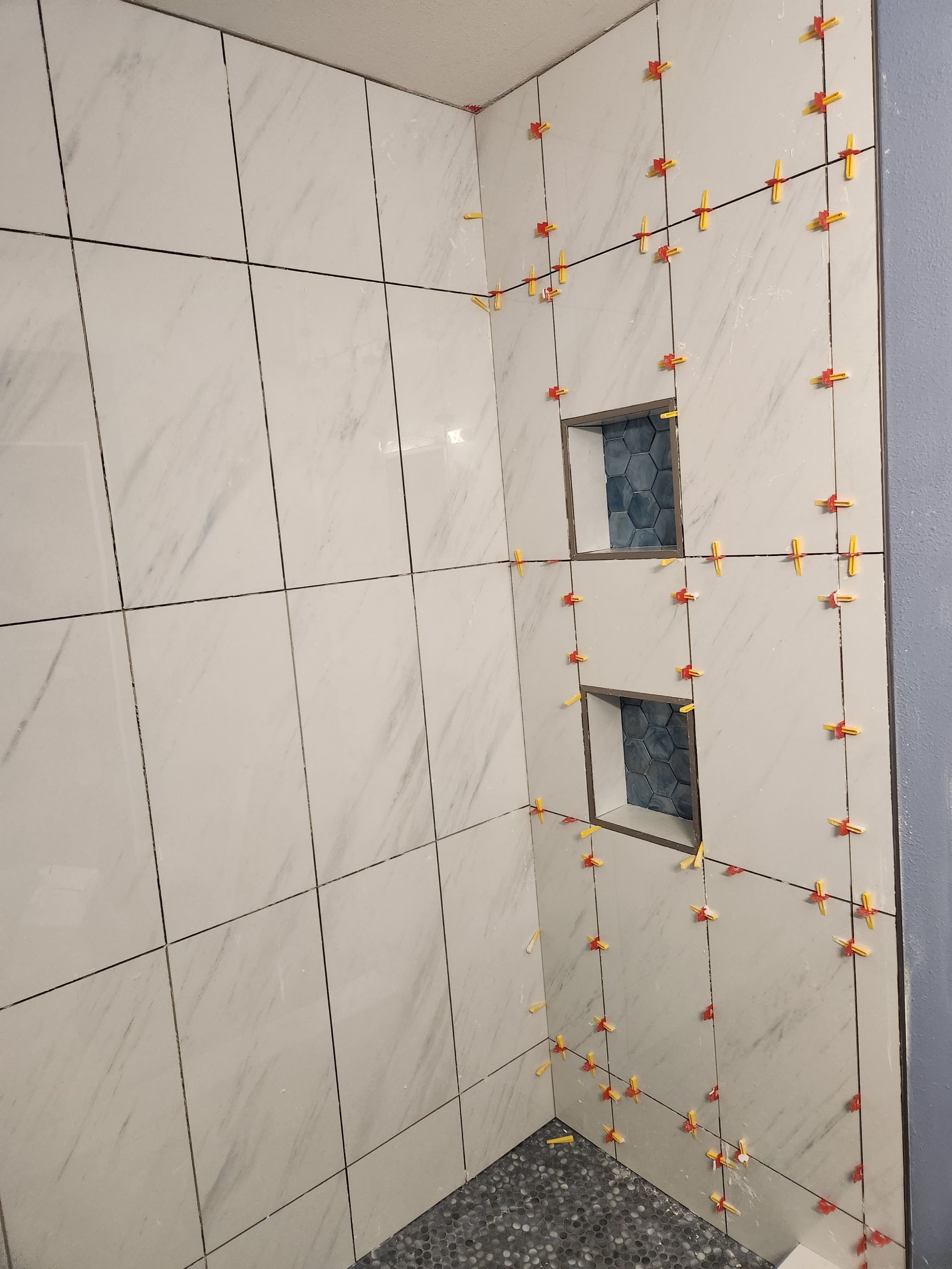 Austin Bathroom 2 and a half Remodel Featuring Tile and Custom Niches by RejuveNate Renovations LLC