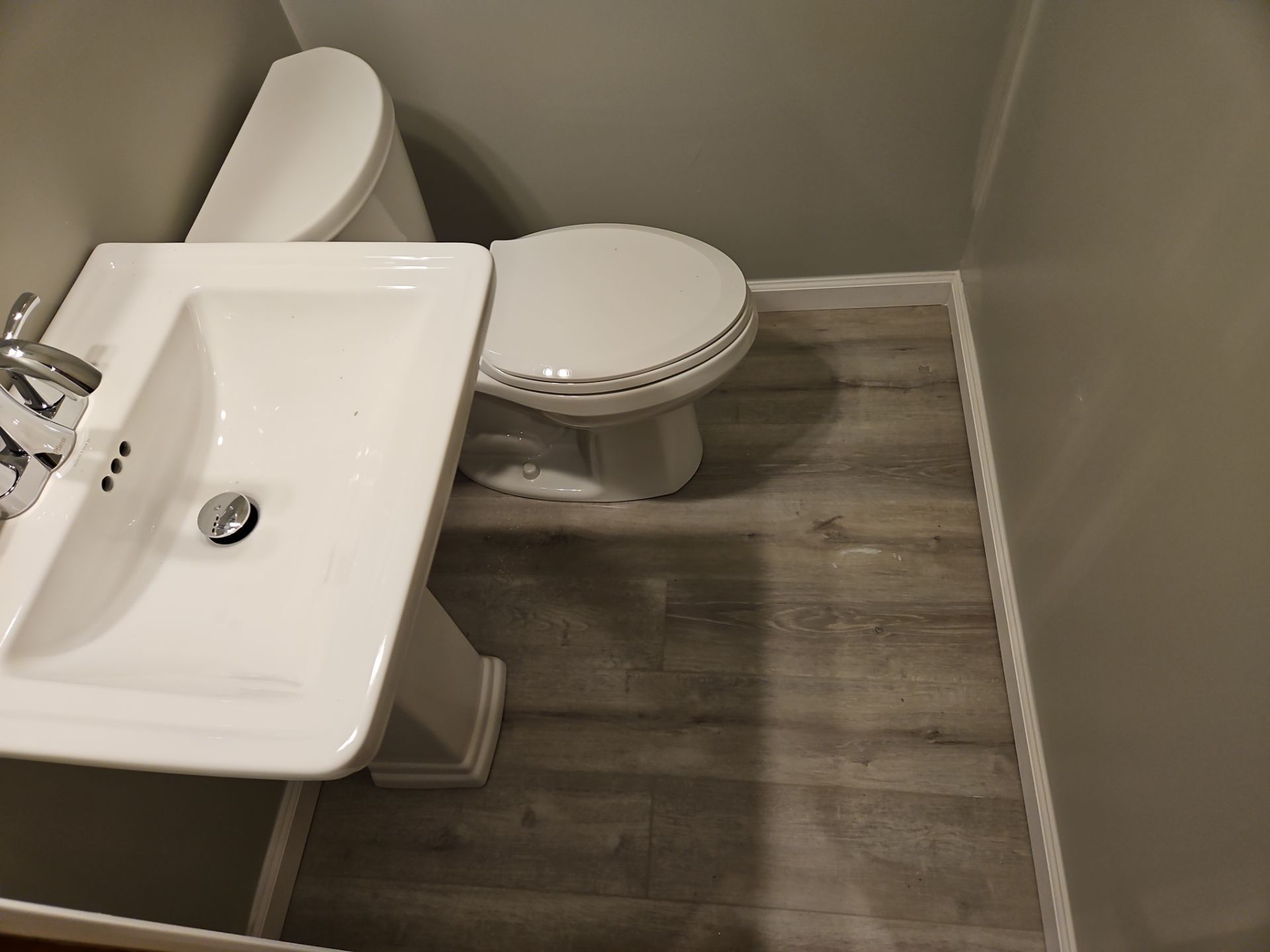 Bathroom Remodel using Luxury Vinyl Plank by The Shower Company