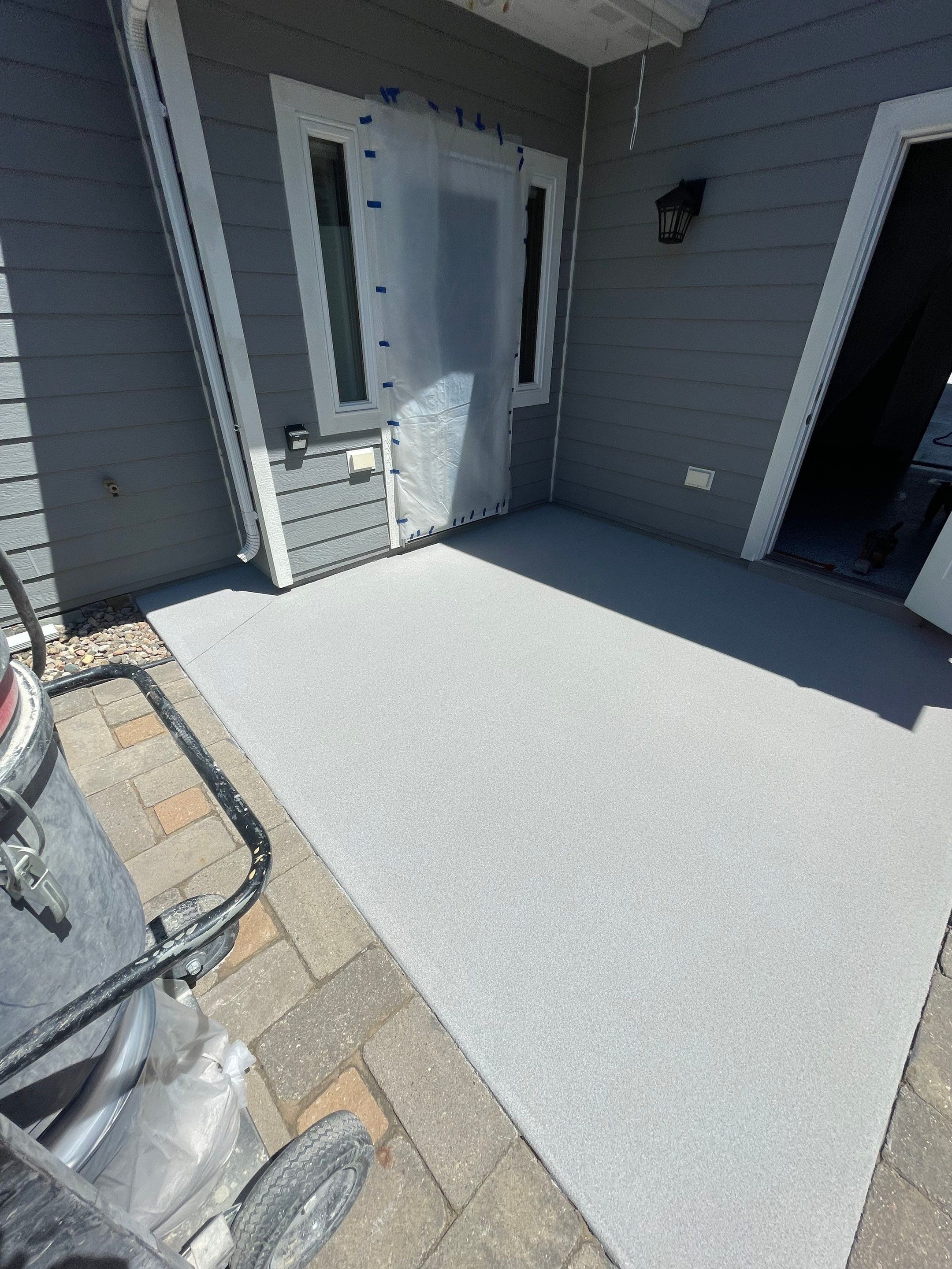 Concrete Patio Coating with Fuzzy Wool Finish in Sioux Falls by Select Painting, Coatings & Garage Cabinets