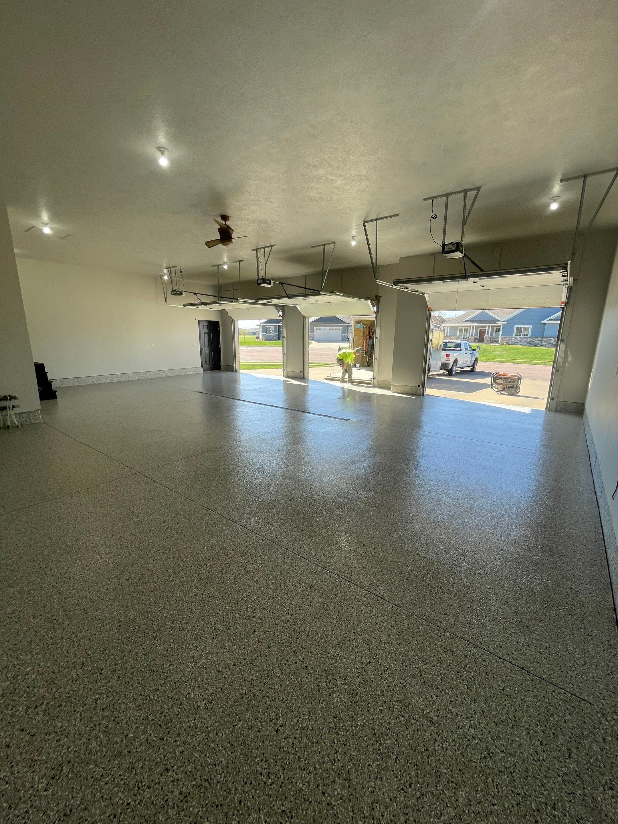 Multi-Car Garage Epoxy Floor Coating in Beresford by Select Painting, Coatings & Garage Cabinets