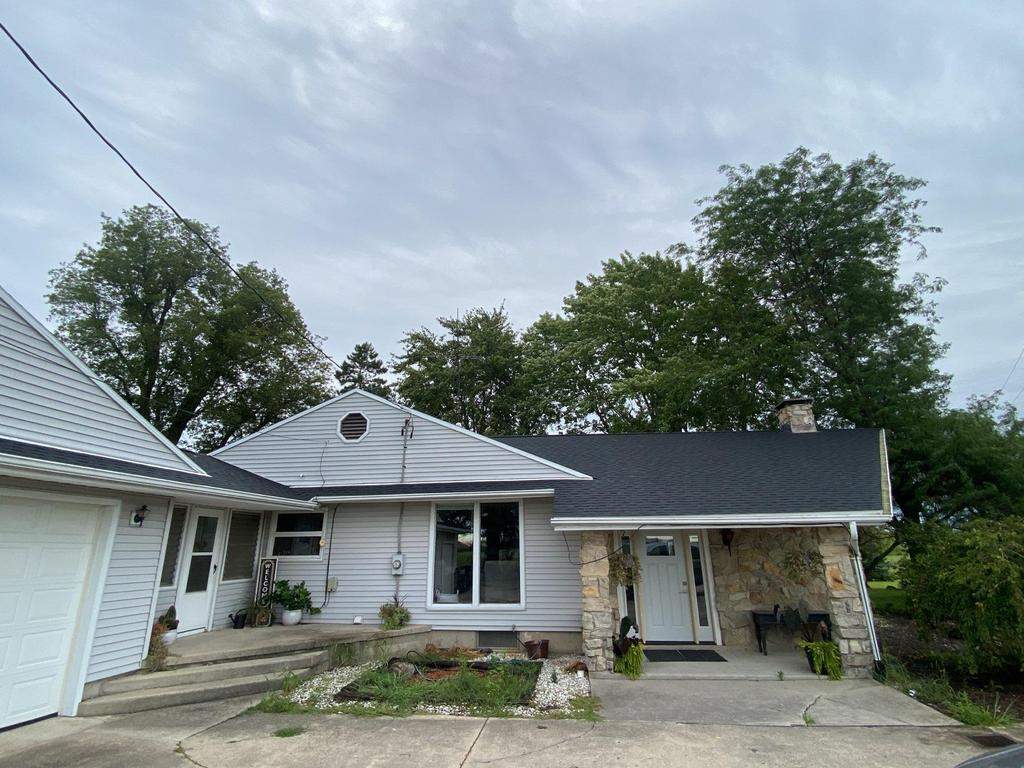Storm damage roof replacement by Nitro Roofing and Construction