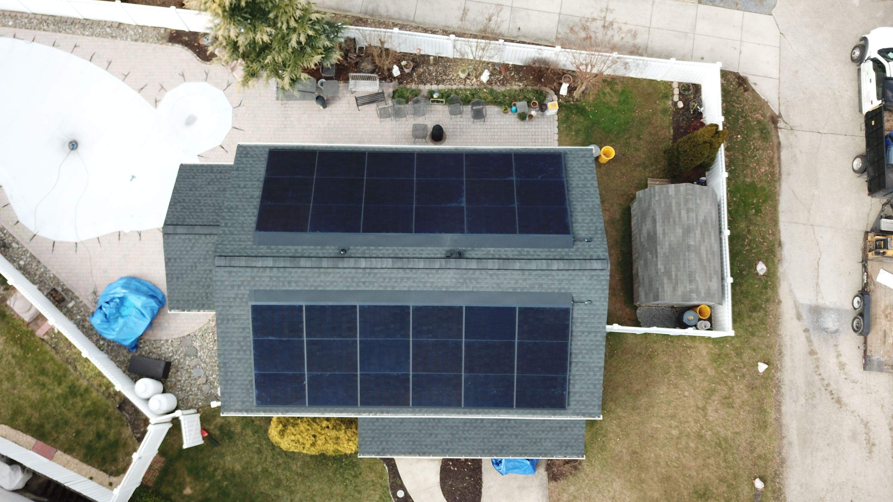 Roof Replacement with GAF Decotech integrated solar panels by American Home Contractors
