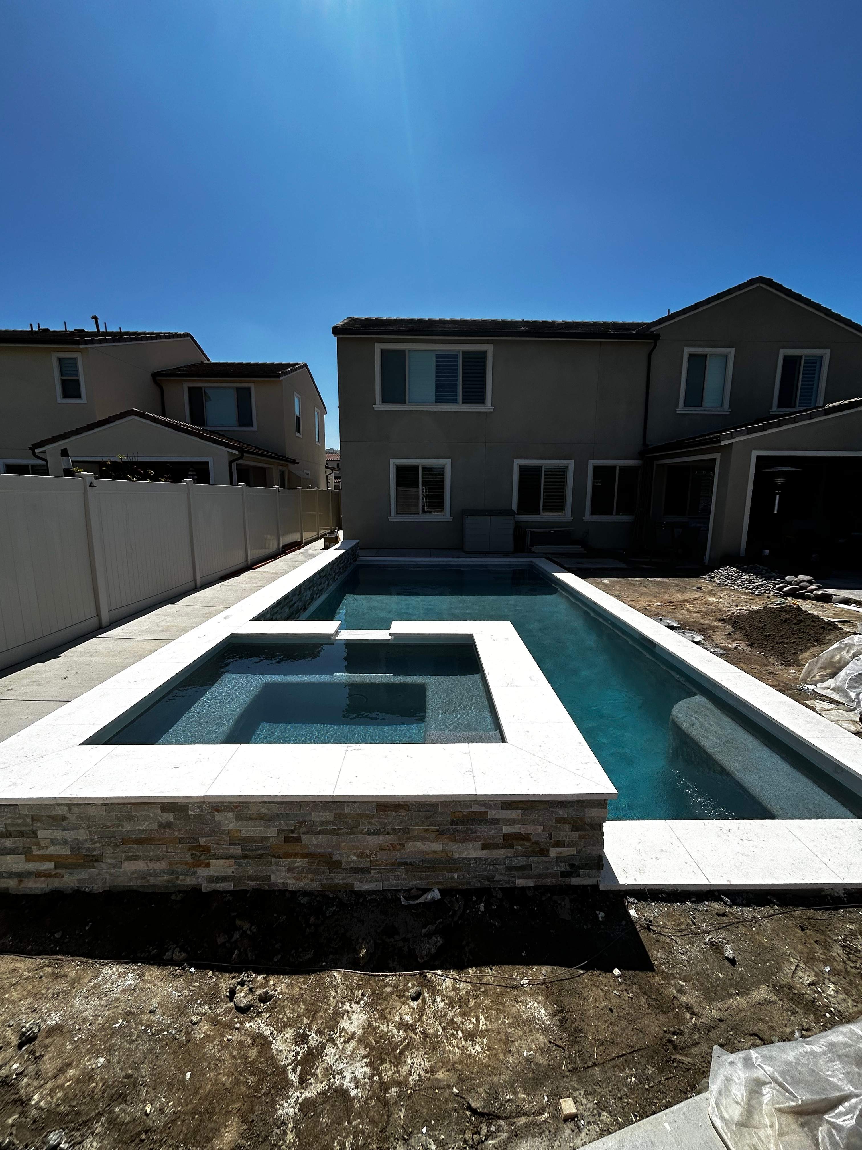 Beautiful pool and spa with water feature by Premier Pools and Spas Temecula