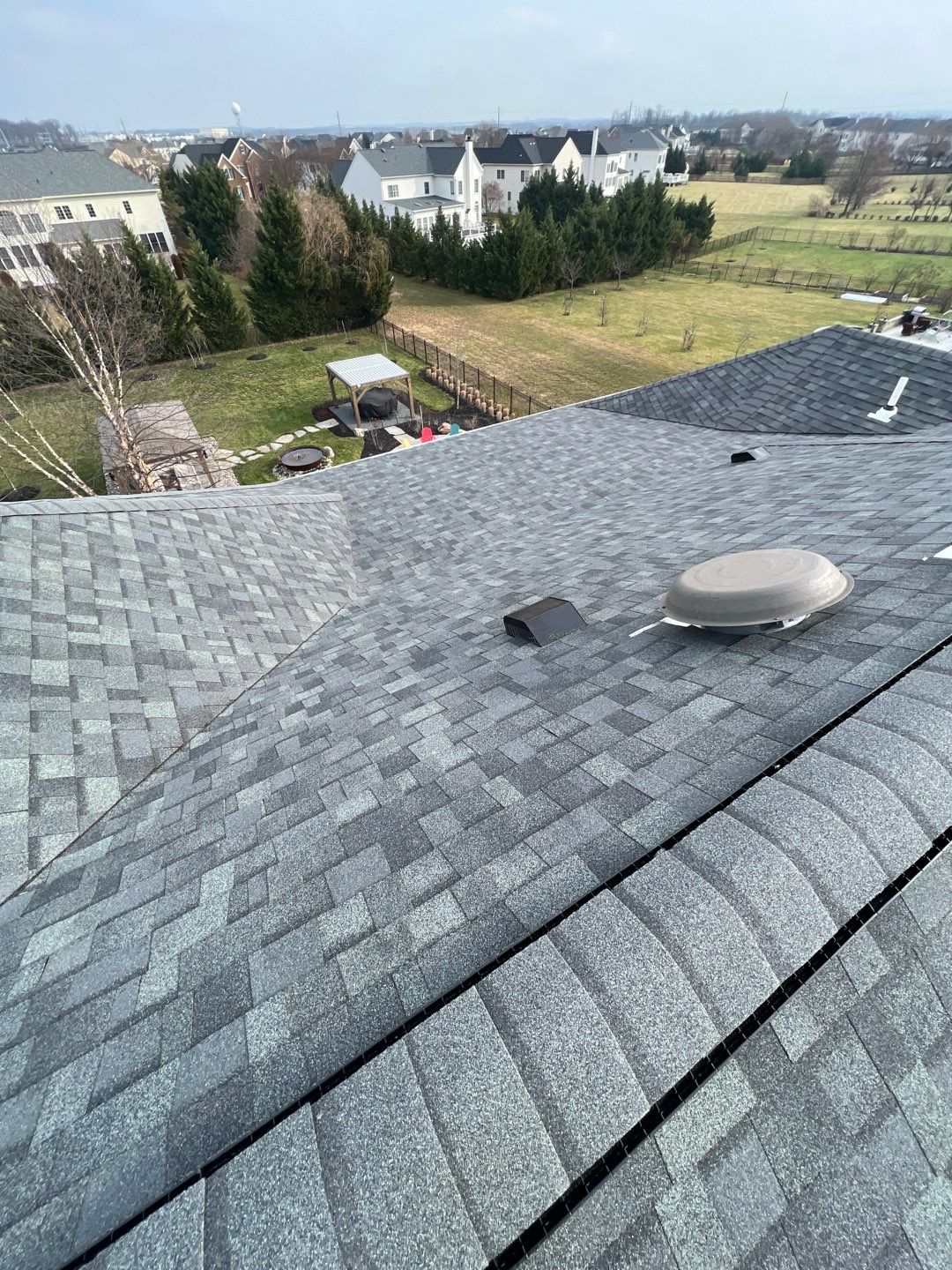 Estate Gray Shingles by Reimagine Roofing