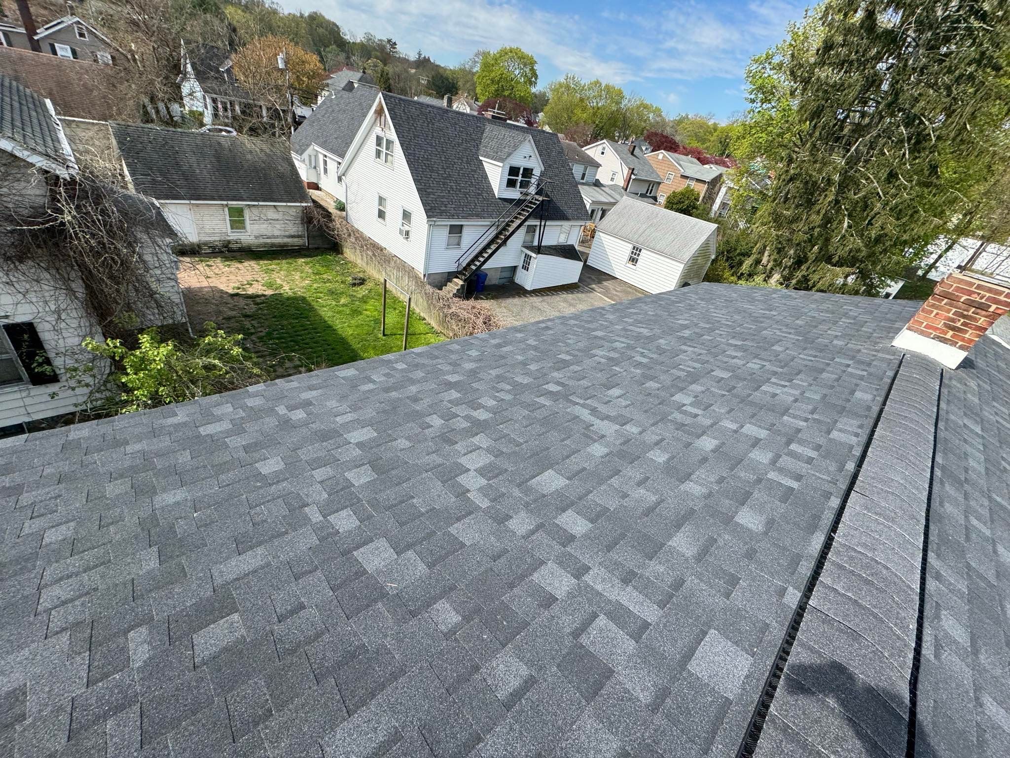Charcoal Shingles by Reimagine Roofing