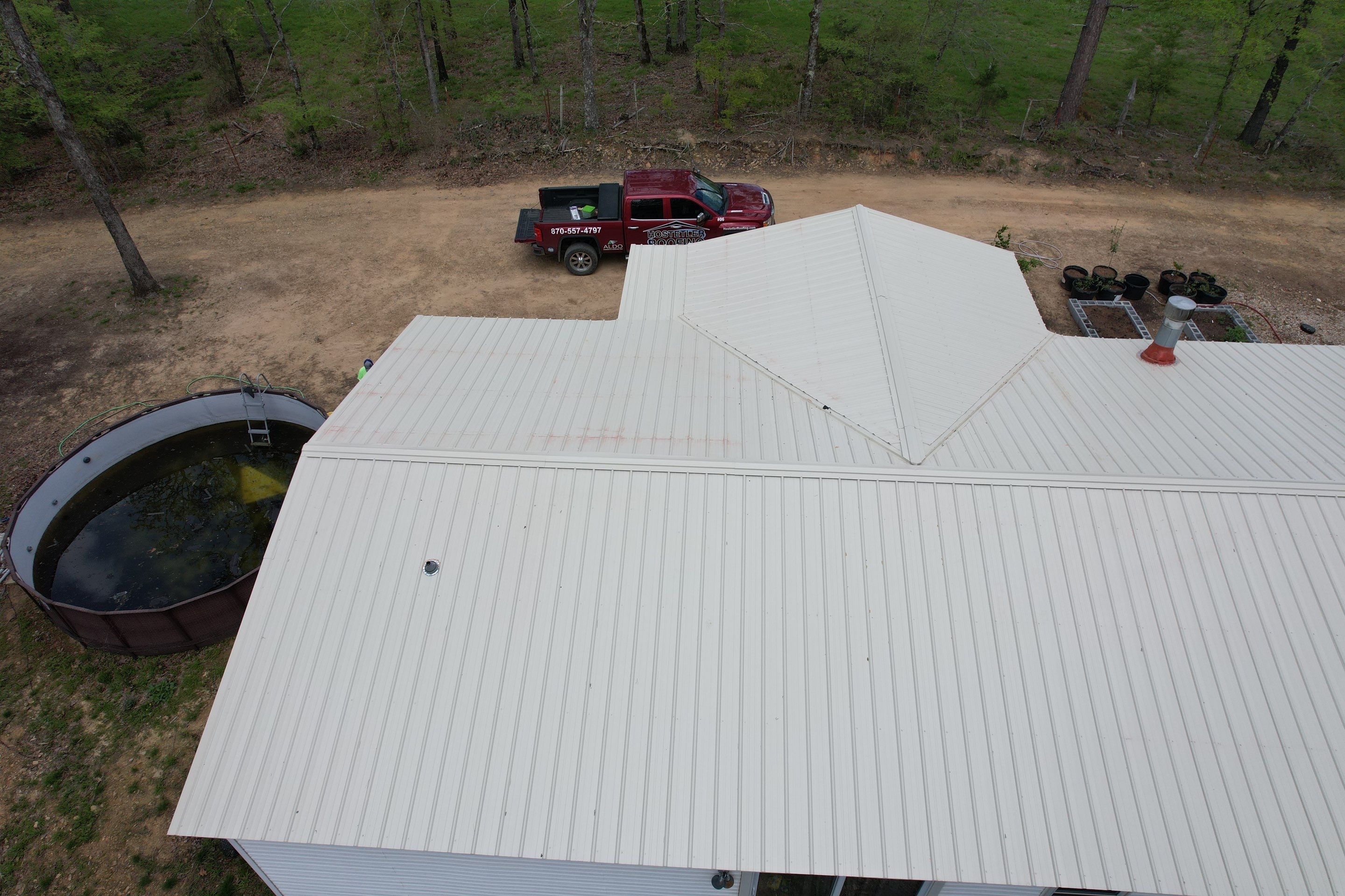 Residential Roofing Installation using 26 Gauge Colored Panels by Hostetler Roofing