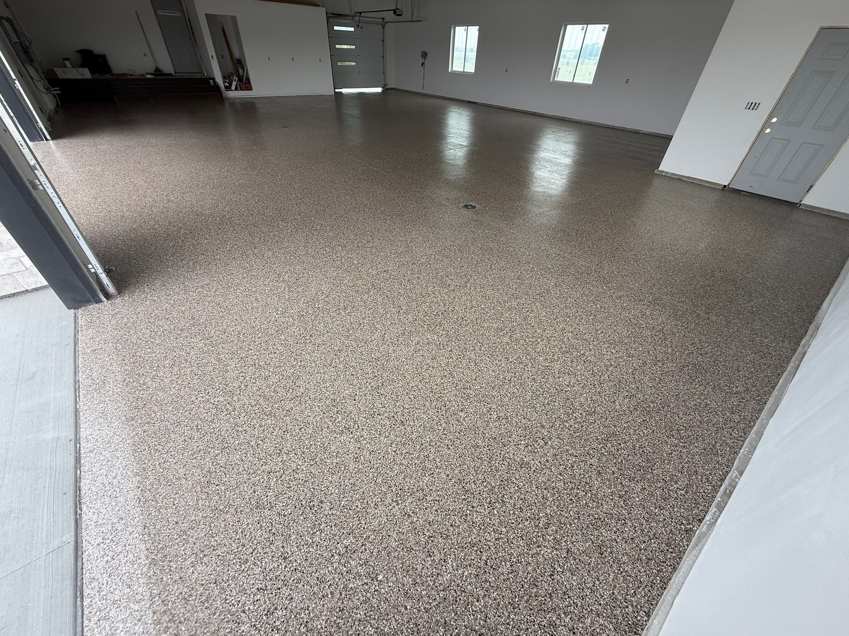 Multi-Bay Garage Concrete Coating and Floor Refinishing in South Dakota by Select Painting, Coatings & Garage Cabinets