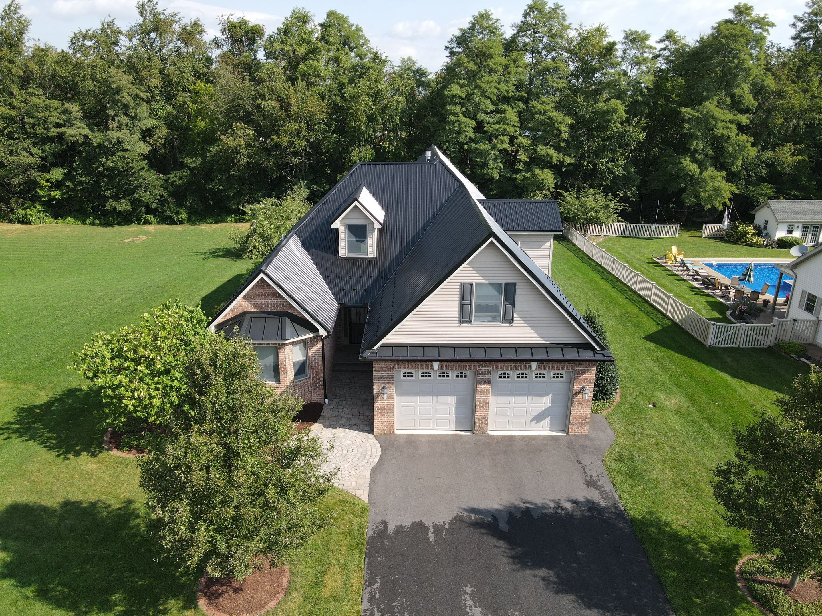 Standing seam / Azm panel in black  by Teflon Roofing