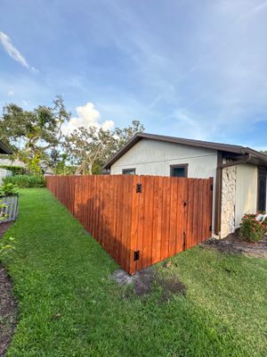 Wood Fence Installation using Pre-stained Pine Board On Board
