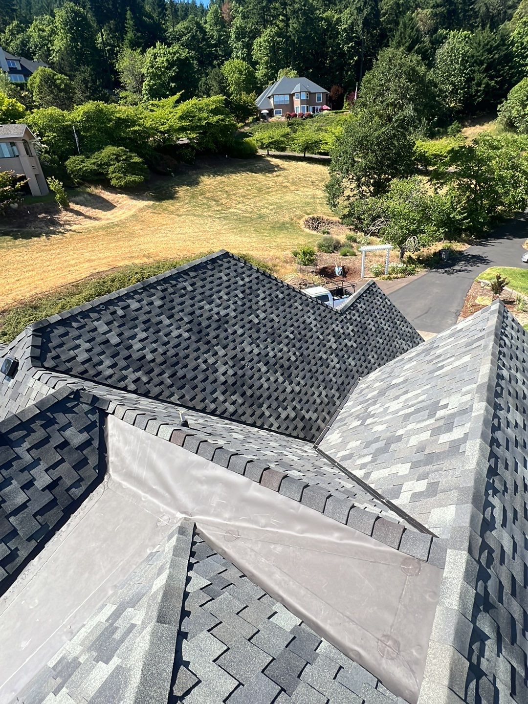 Residential Roofing Installation using Malarkey Windsor 50 Year Shingle (Color: Storm Grey) by Orezona Building & Roofing Company, Inc.