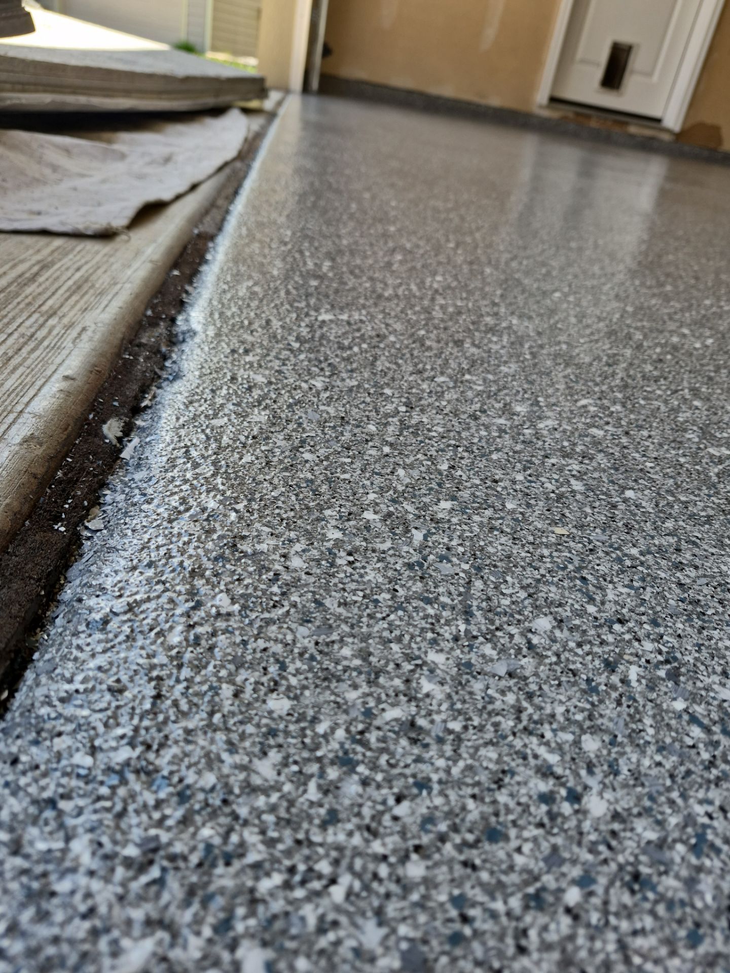 Garage Floor Coating Installation in Post Falls with Canfield Hybrid Flakes by Croc Coatings, LLC