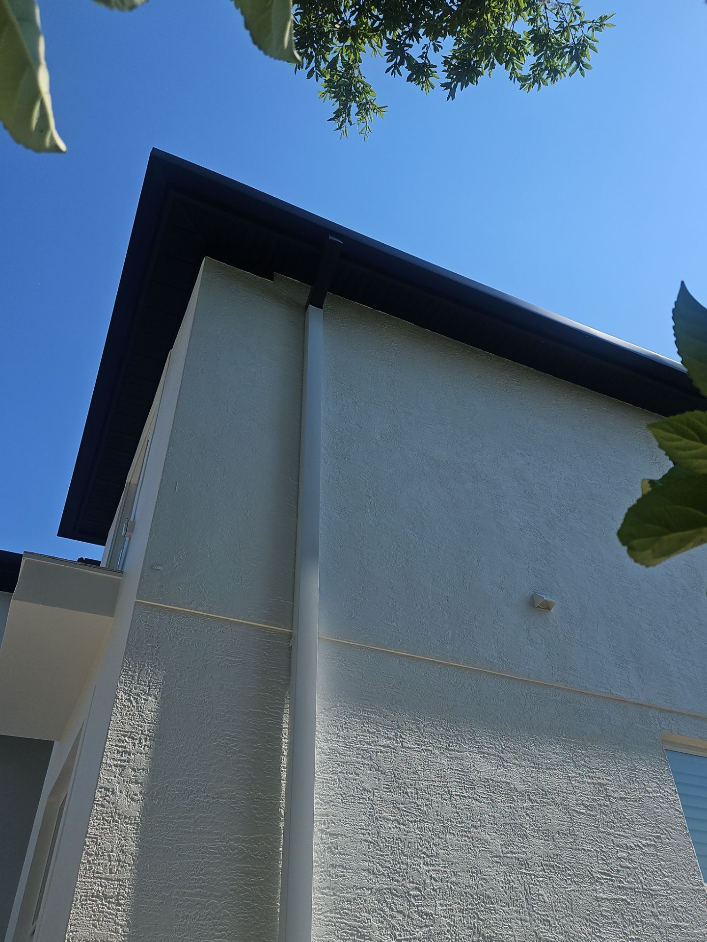 Soffit and Fascia Installation and black seamless gutters in Sarasota FL by Gutter Professors