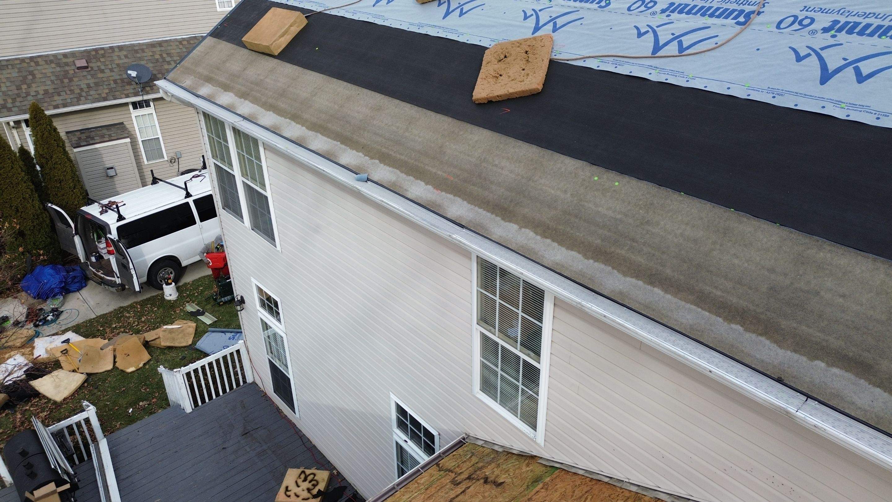 Walden Ponds - Pristine Black and Hydro Flo Gutter Guards by Tamlin Roofing