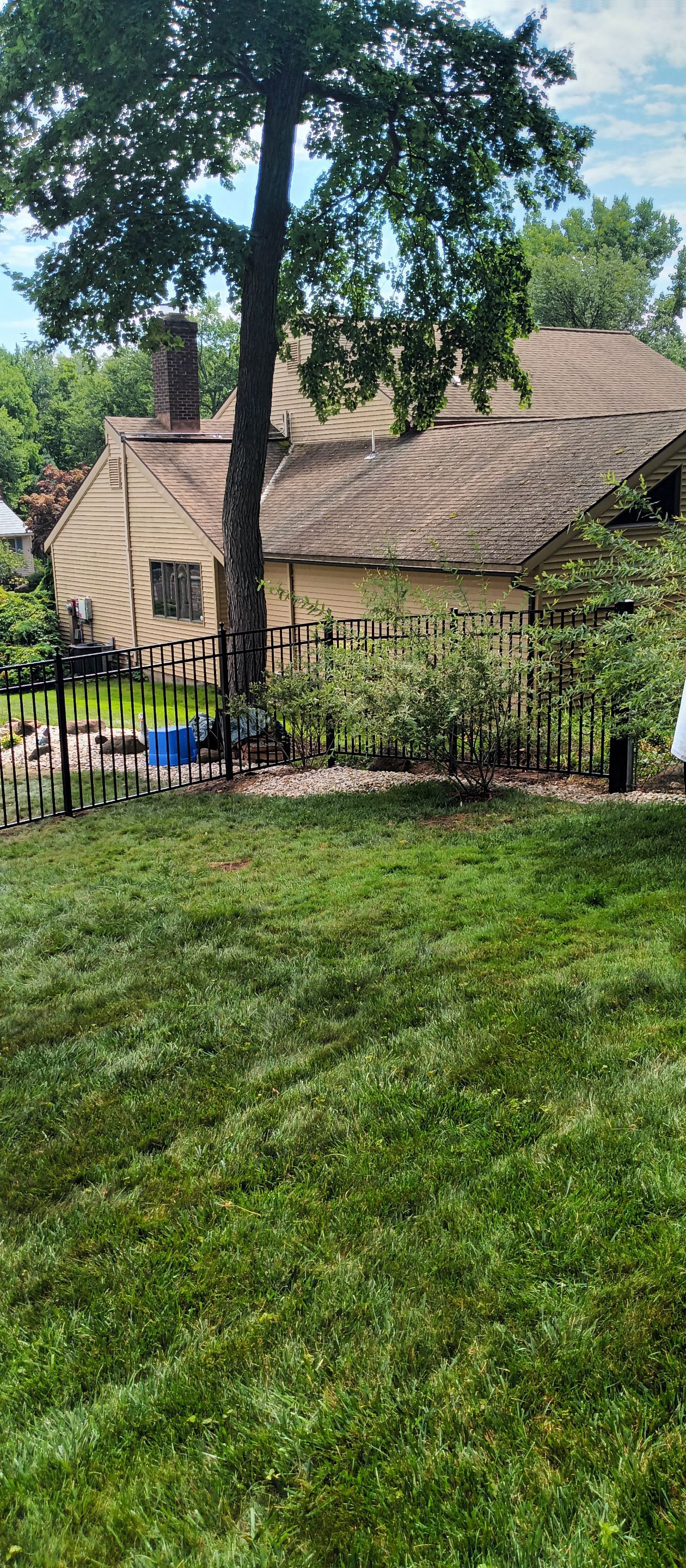 New Black Aluminum fence with matching gates by DiGiorgi Roofing and Siding Inc