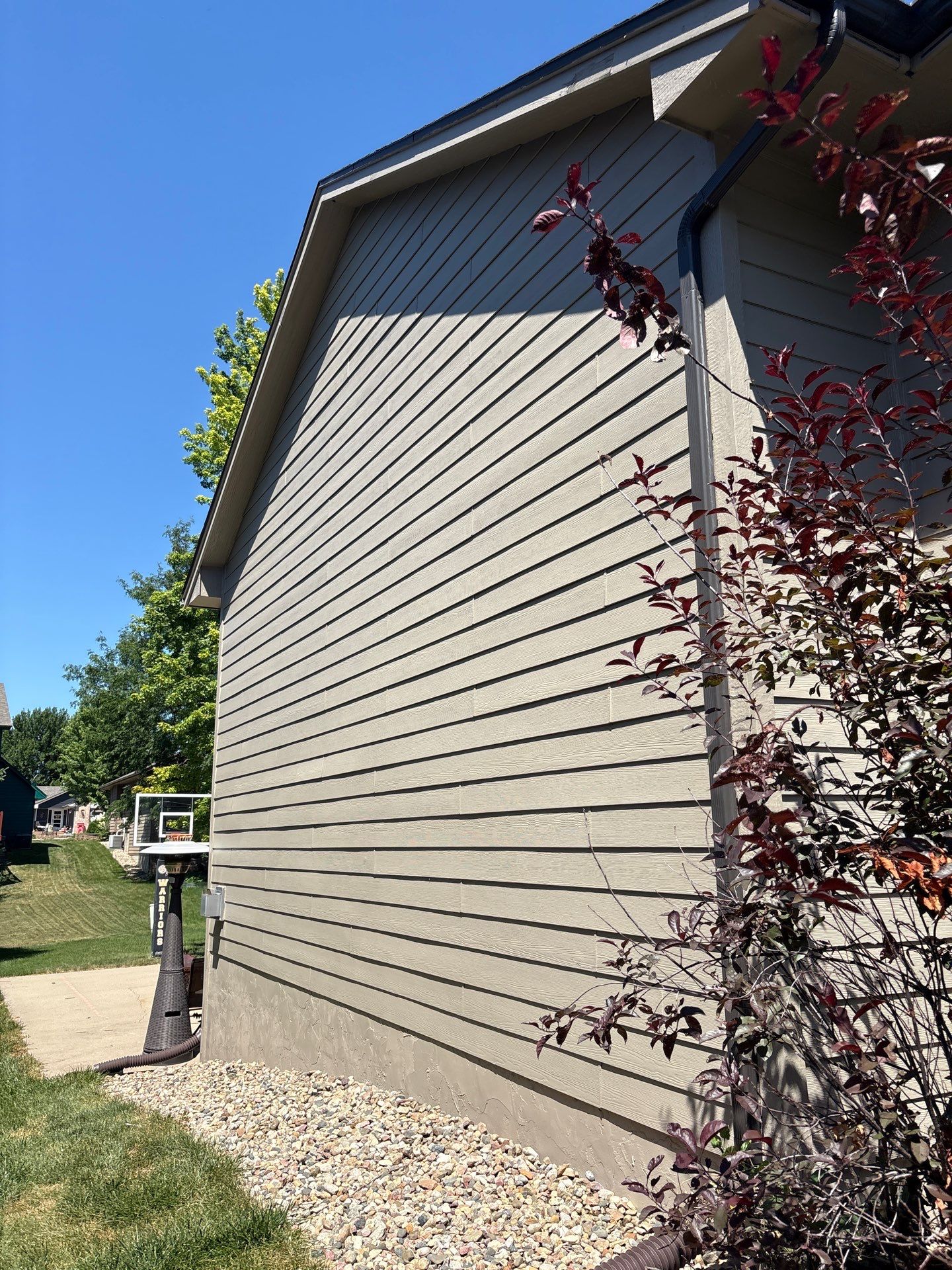 Residential Exterior Painting and Trim Restoration in Sioux Falls by Select Painting, Coatings & Garage Cabinets