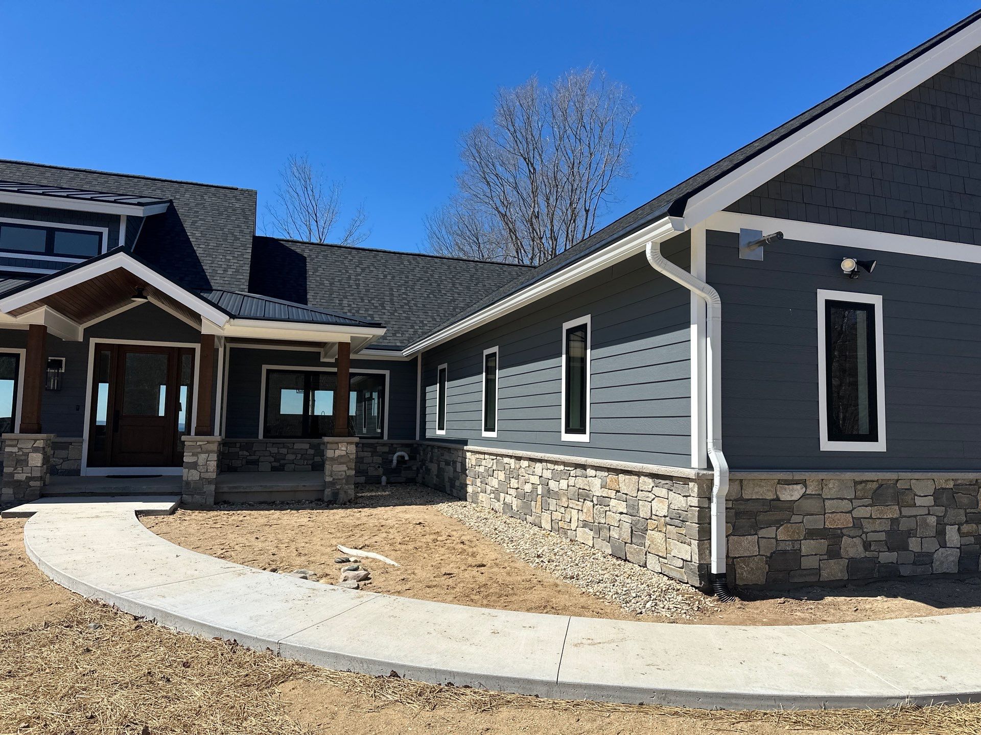 Residential Gutter and Downspout Installation for Ellsworth Home Exterior by Rainbow Seamless Systems
