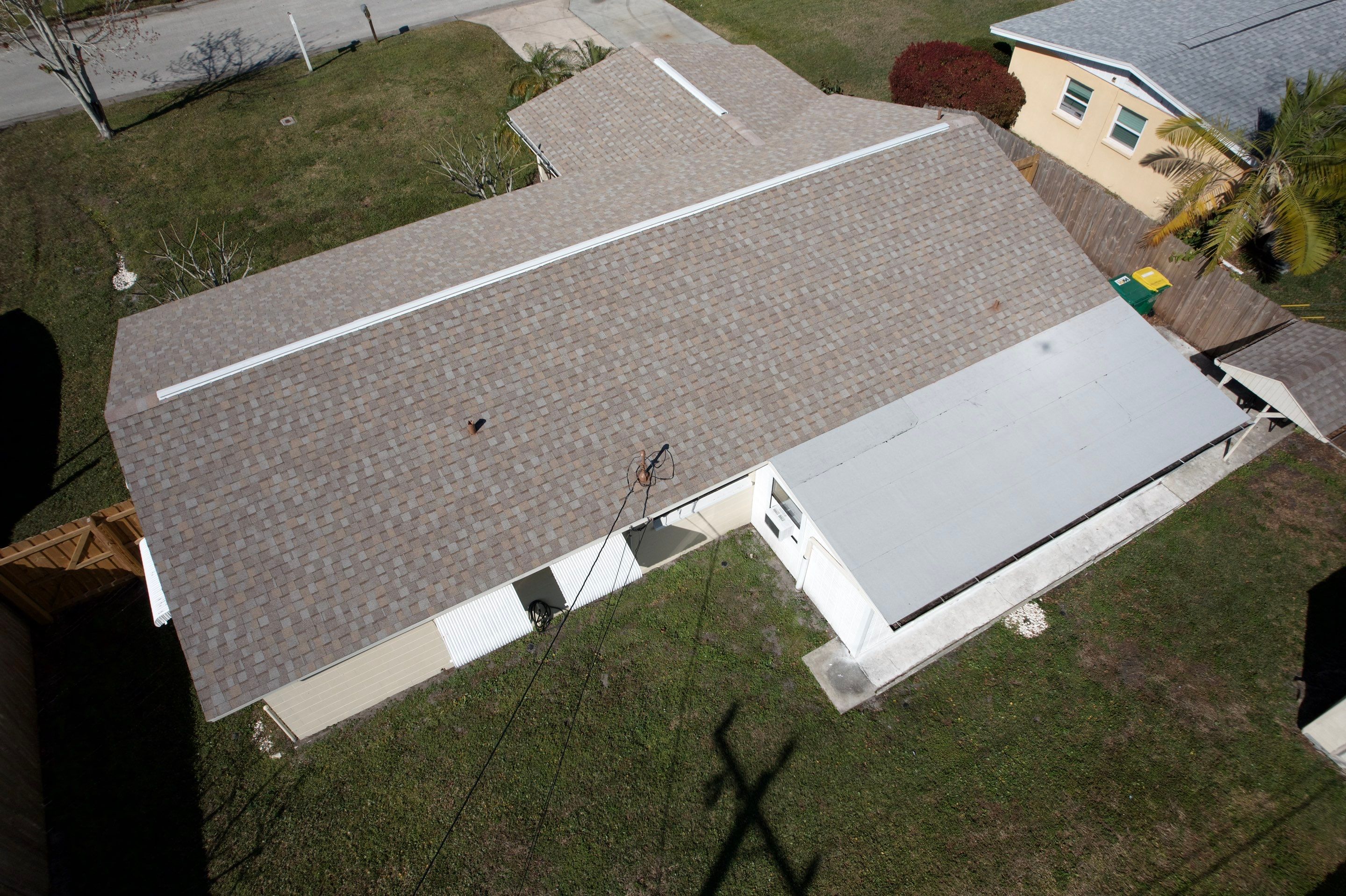 Complete Asphalt Shingle and Flat Roof Replacement in Merritt Island by Wiedmann Construction & Roofing