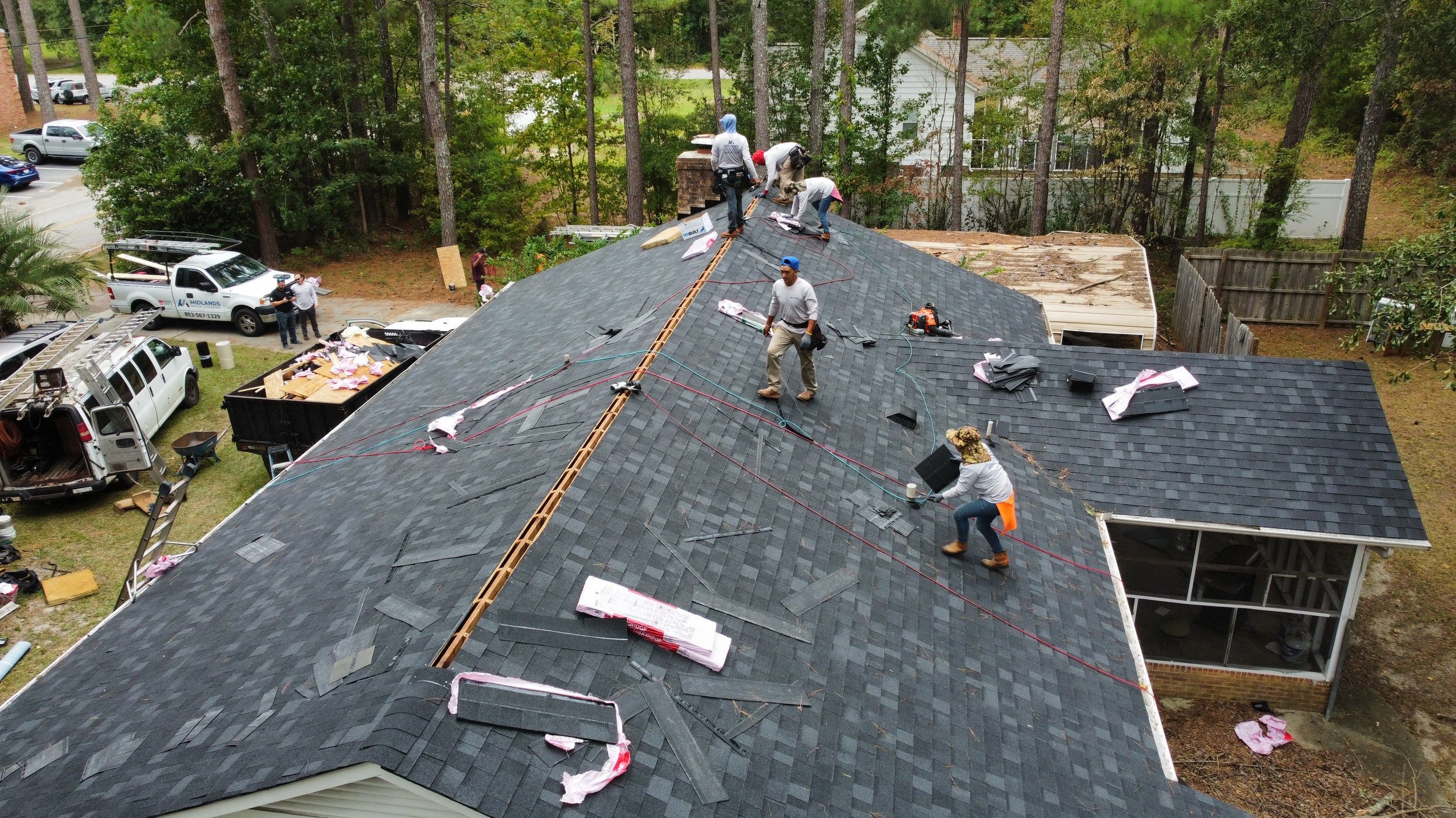New Onyx Black Shingle Roof Replacement and Tree Damage Repair. by Midlands Roofing & Exteriors