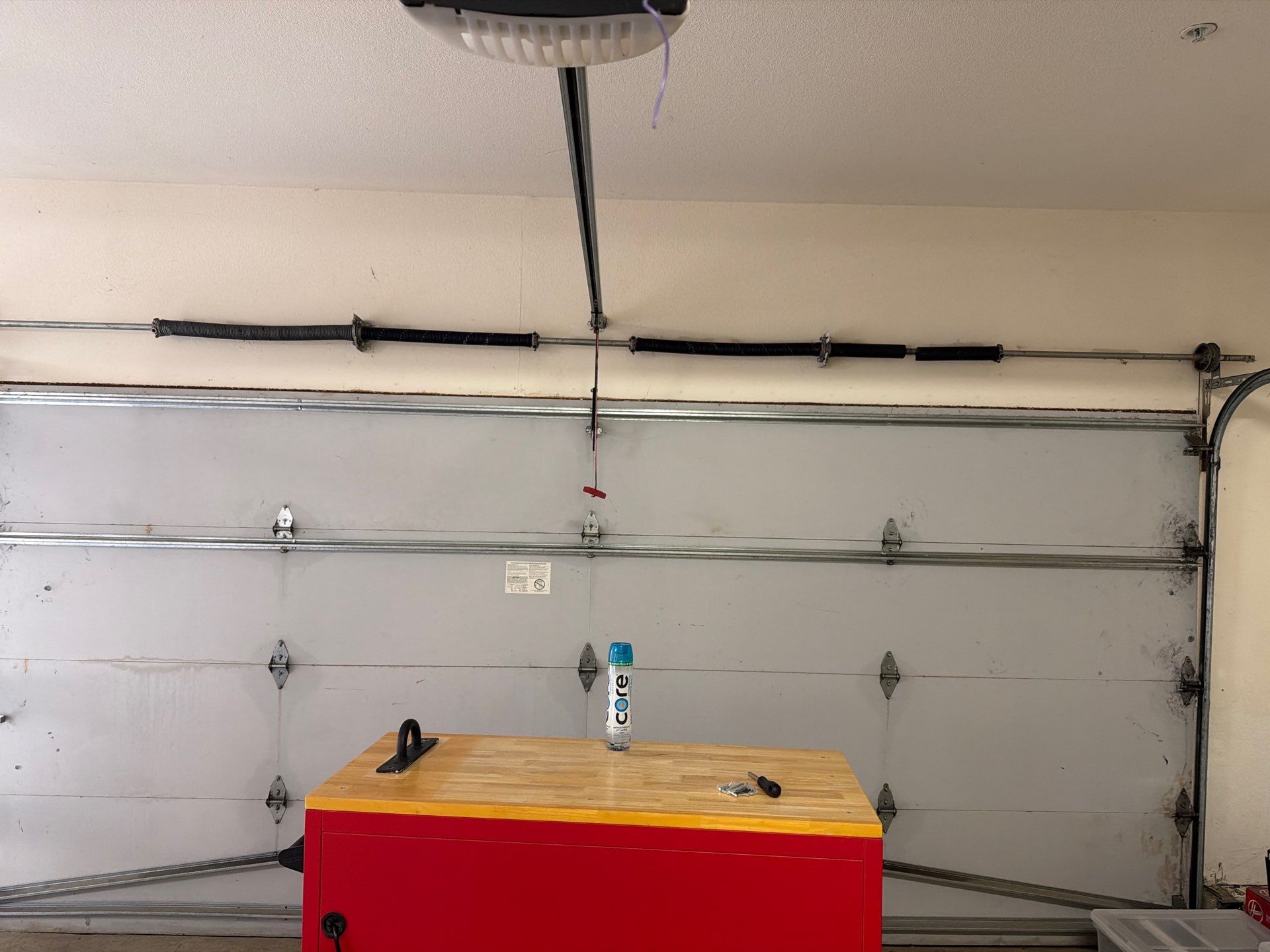 Sectional Garage Door Torsion Spring Replacement and Hardware Service by Valiant Garage Door