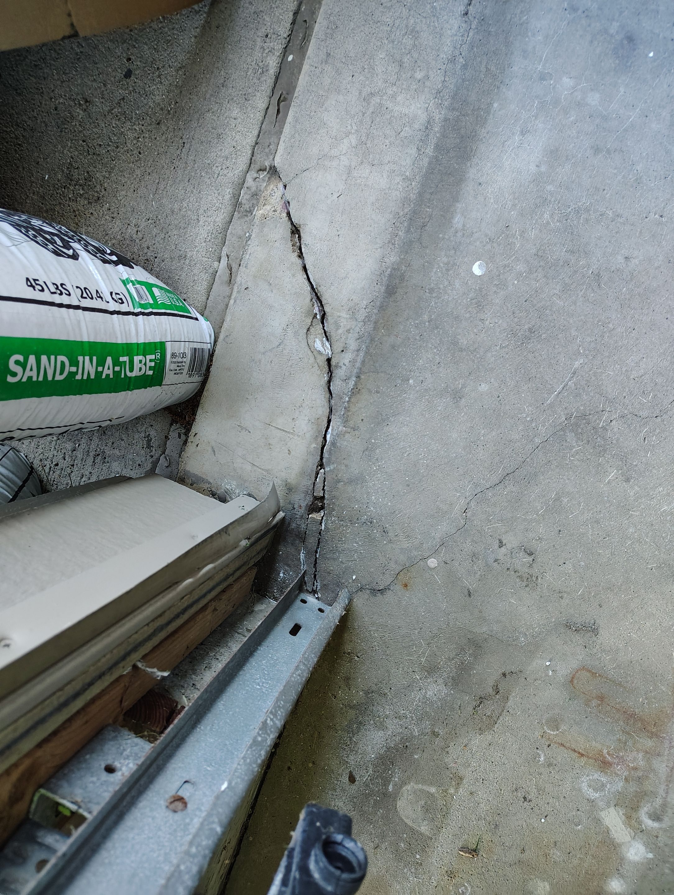 Sioux Falls Garage Concrete Repair and Epoxy Flake Floor Coating by Select Painting, Coatings & Garage Cabinets