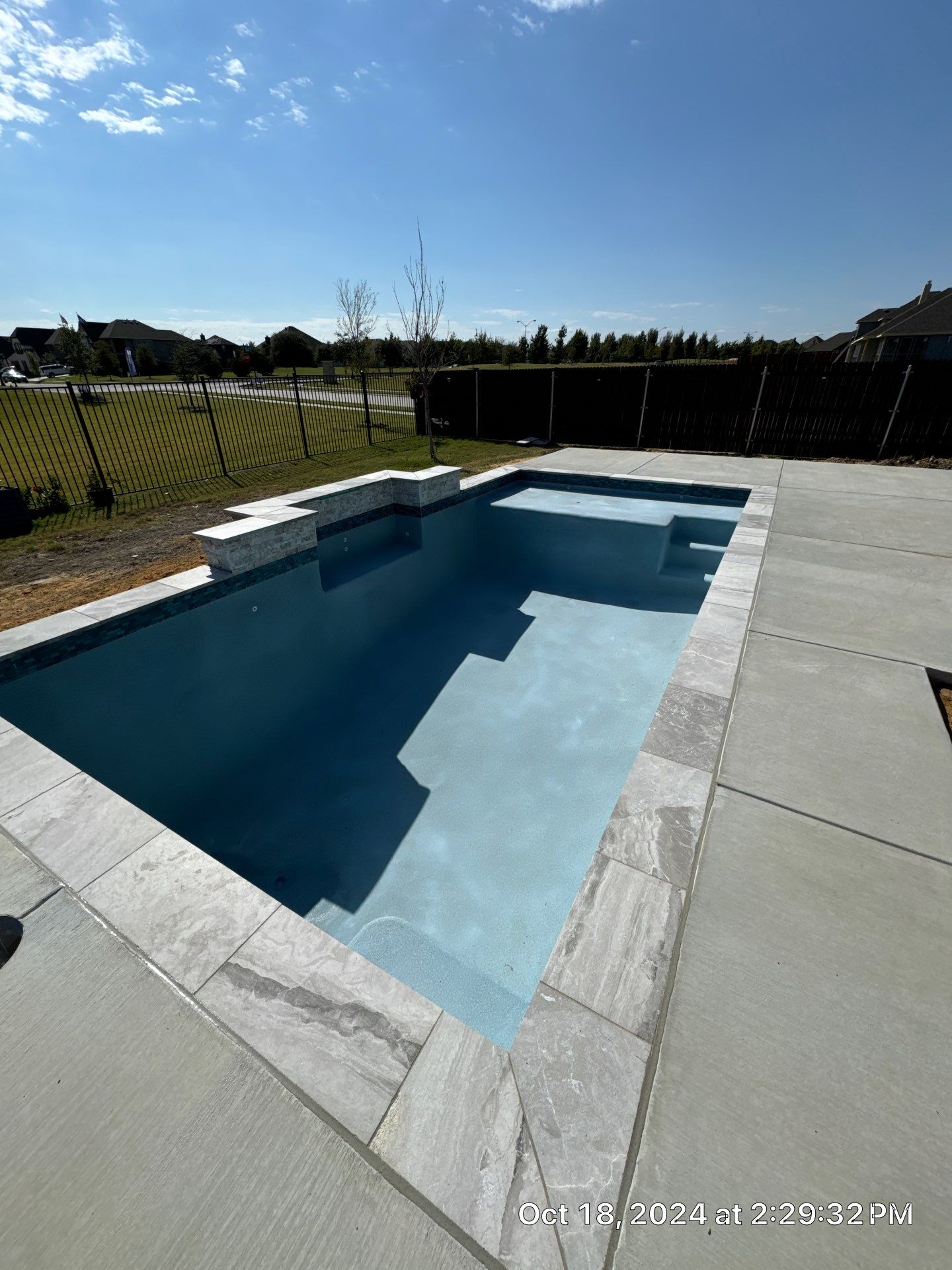 Modern Geometric Pool with Expansive Deck by Pinnacle Pools and Spas - DFW