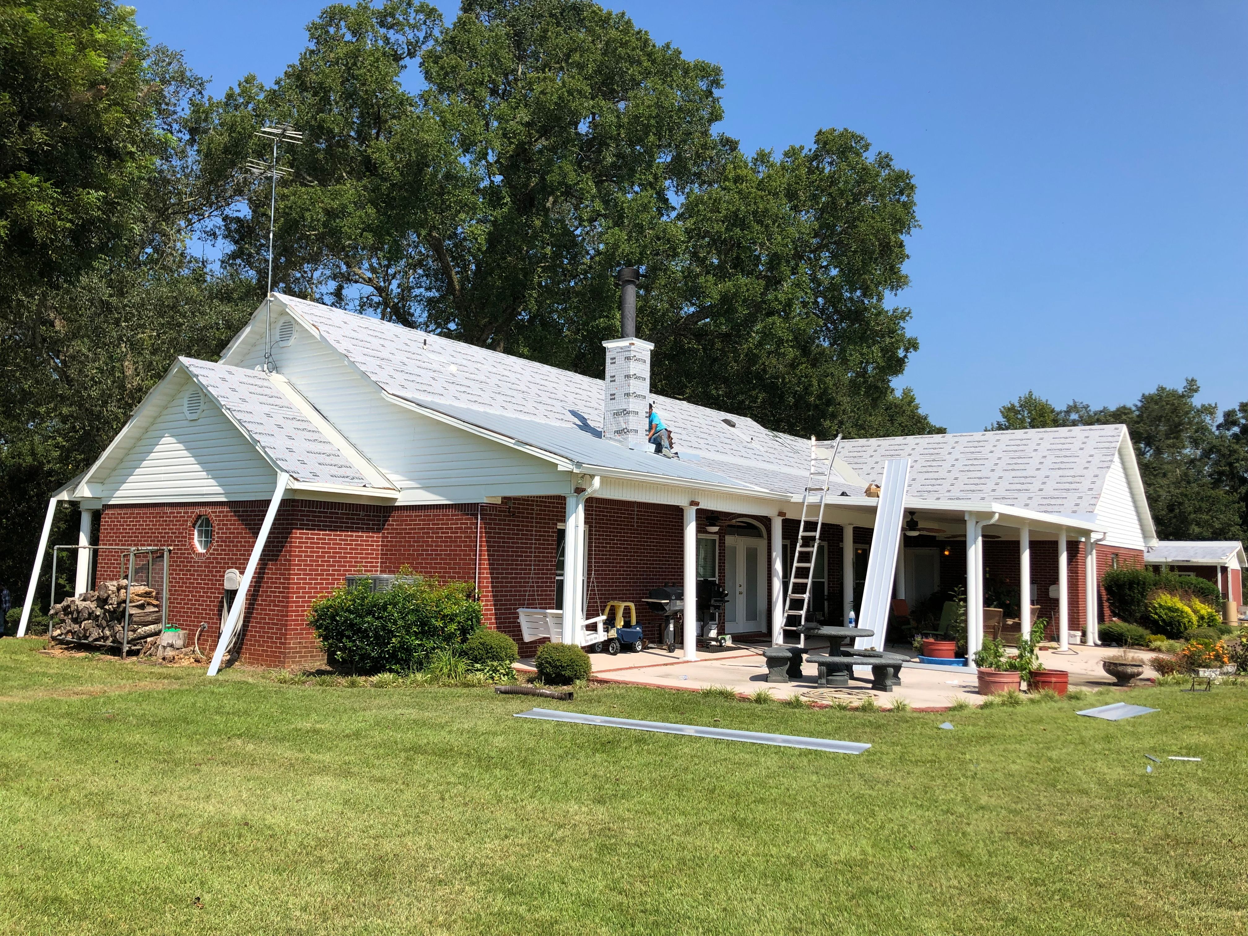 Residential Roofing Installation using Metal roofing by American Roofing & Construction LLC