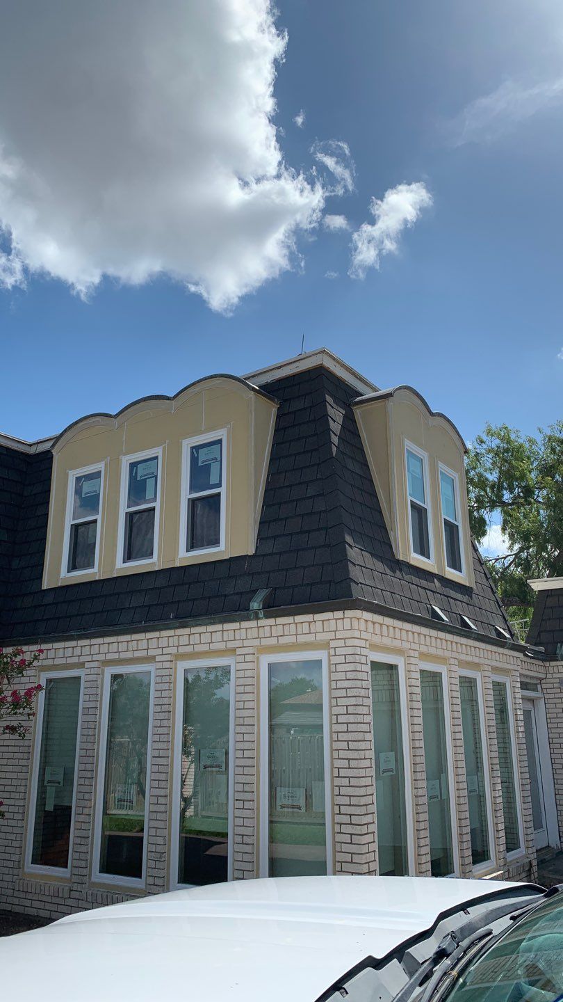 Mansard Charm by Bayfront Roofing and Construction
