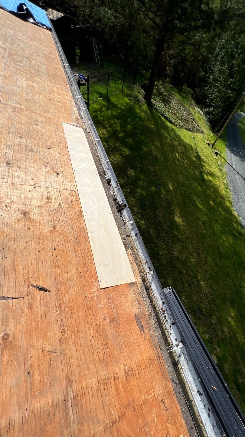 Residential ReRoofing Installation using 12" Prolok metal by Top Notch Roofing Inc