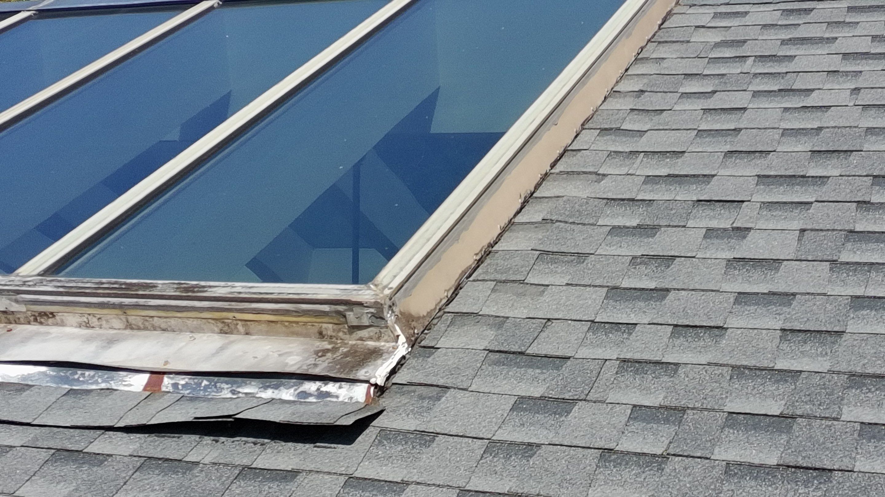 Ridge Skylight Repair and Shingle Roof Maintenance in Winter Park by Fortified Roofing Solutions Corp.