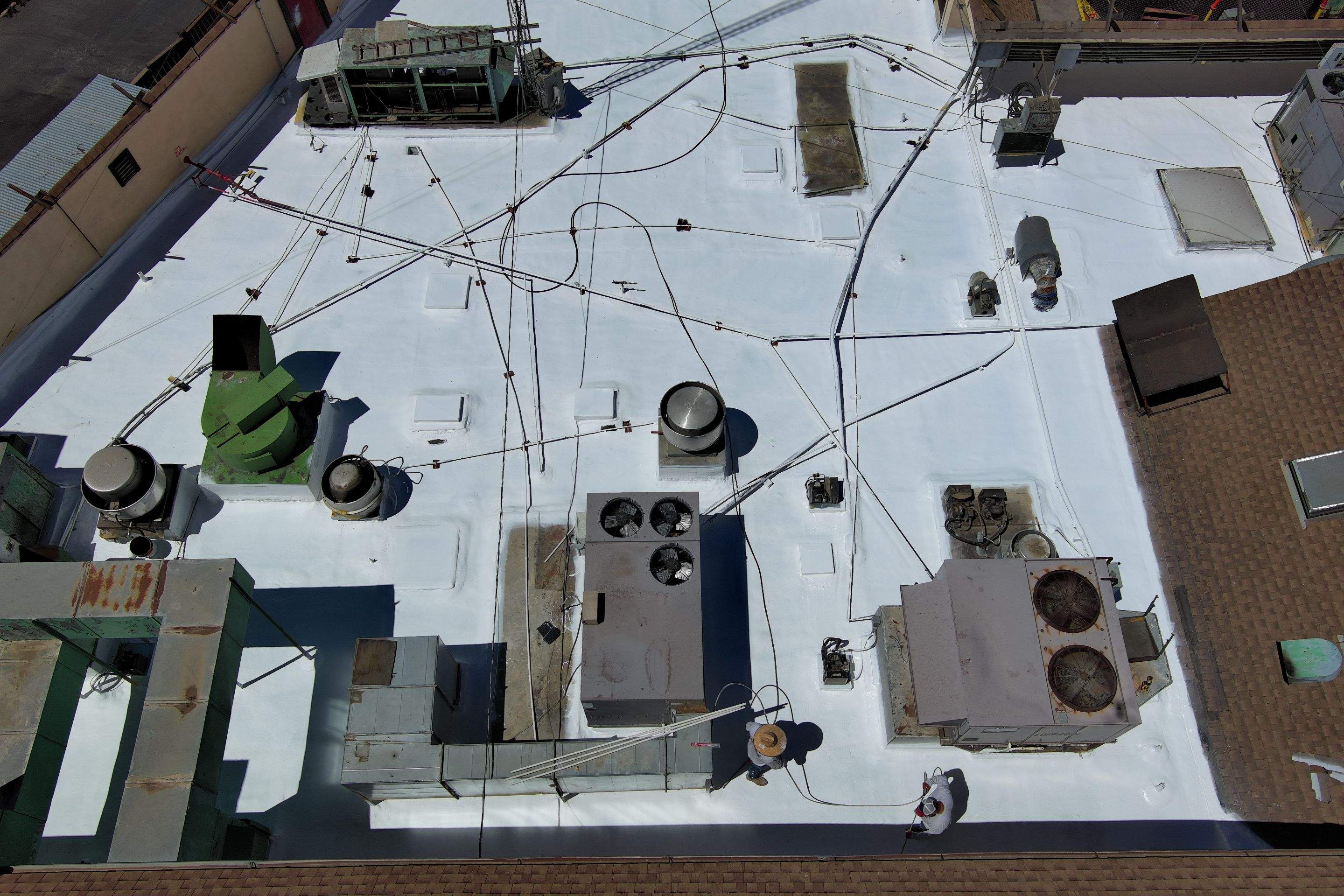 Spray foam and coatings using General Coatings acrylic coatings and spray foam by Straight Edge Roofing Inc