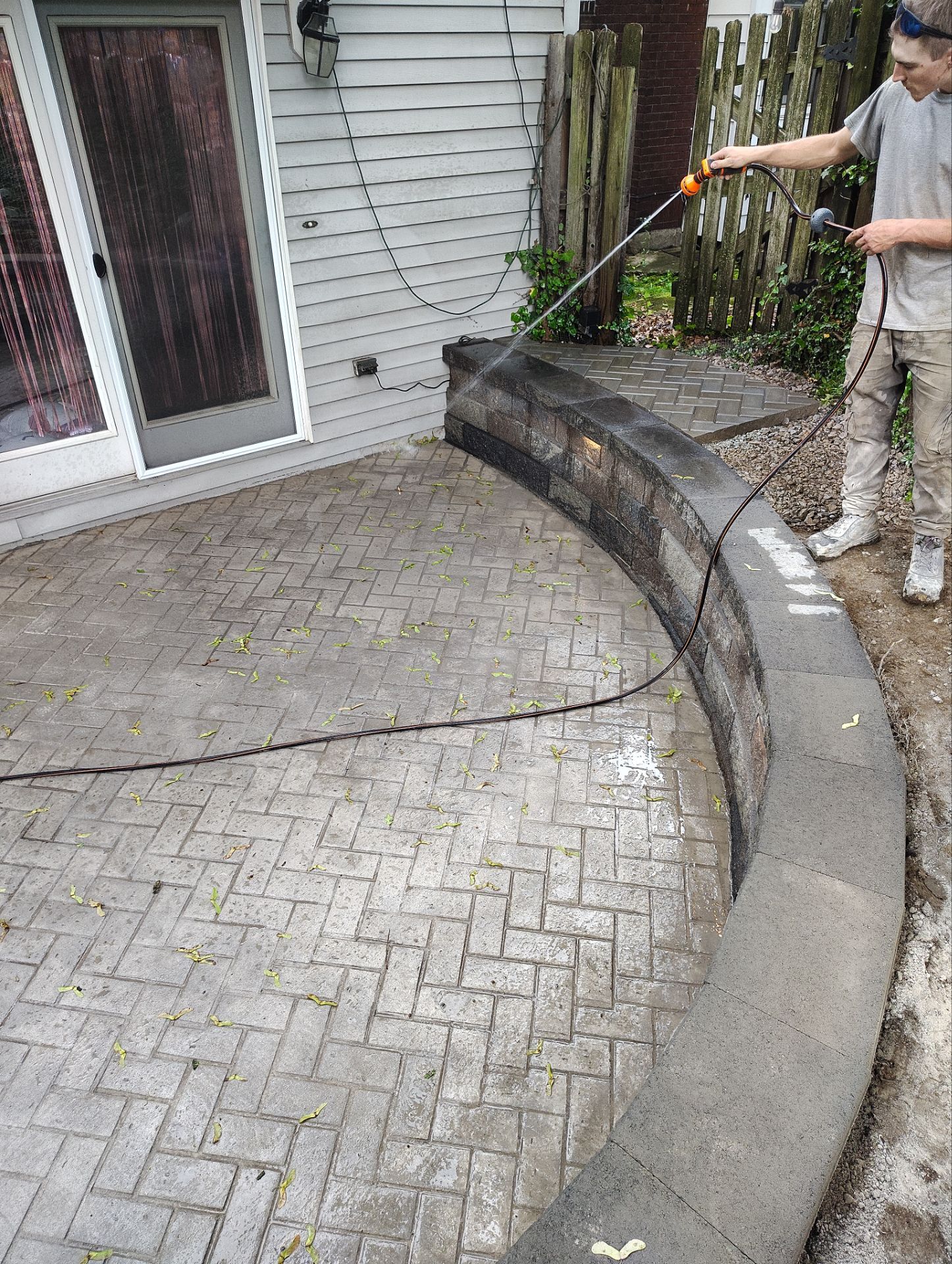 Stamped Concrete and Retaining Wall by Cousins Roofing Siding & Decks
