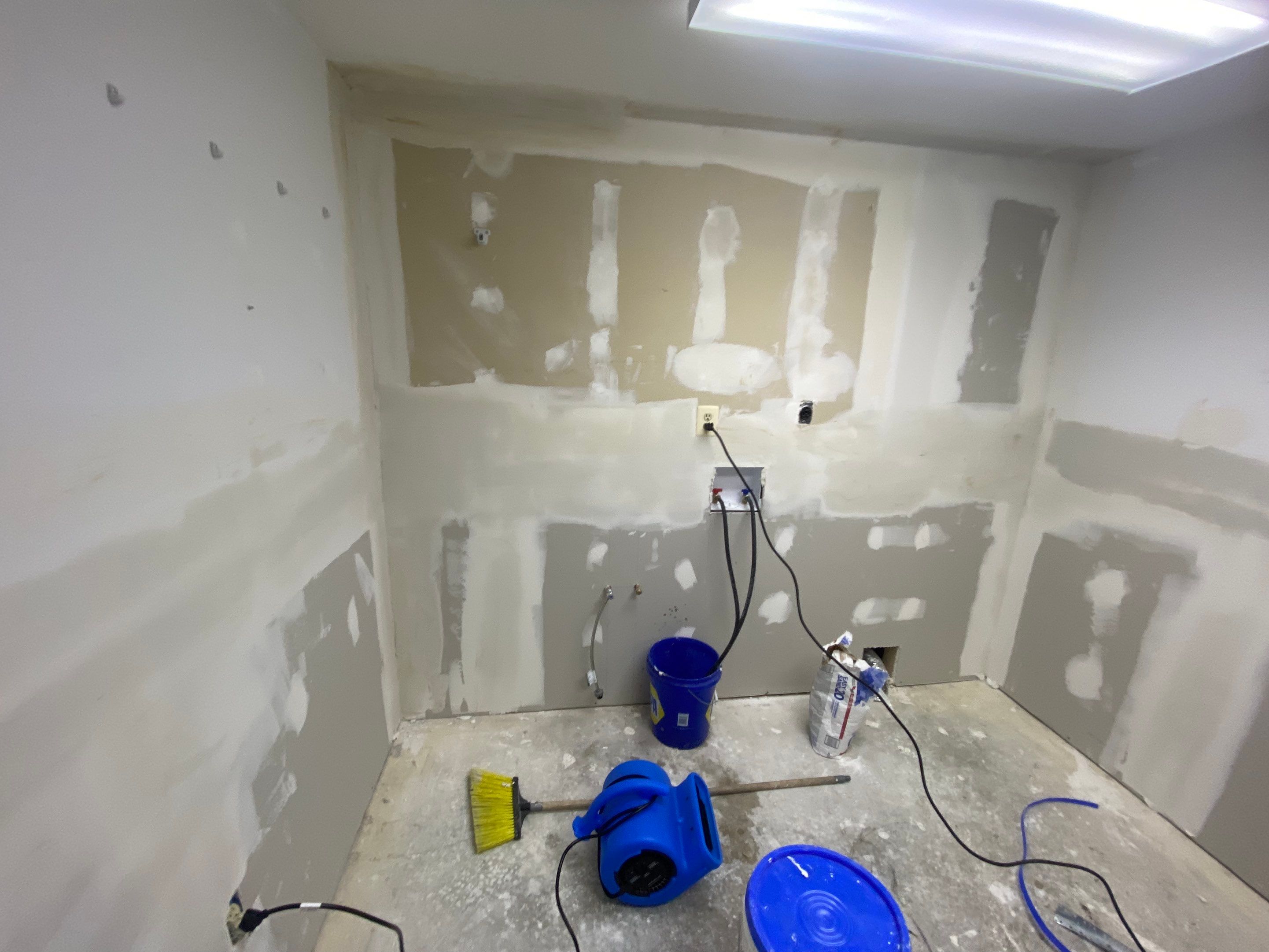 Laundry Room Redmodel using Lifeproof Luxury Vinyl Plank Flooring by The Smet Companies, LLC