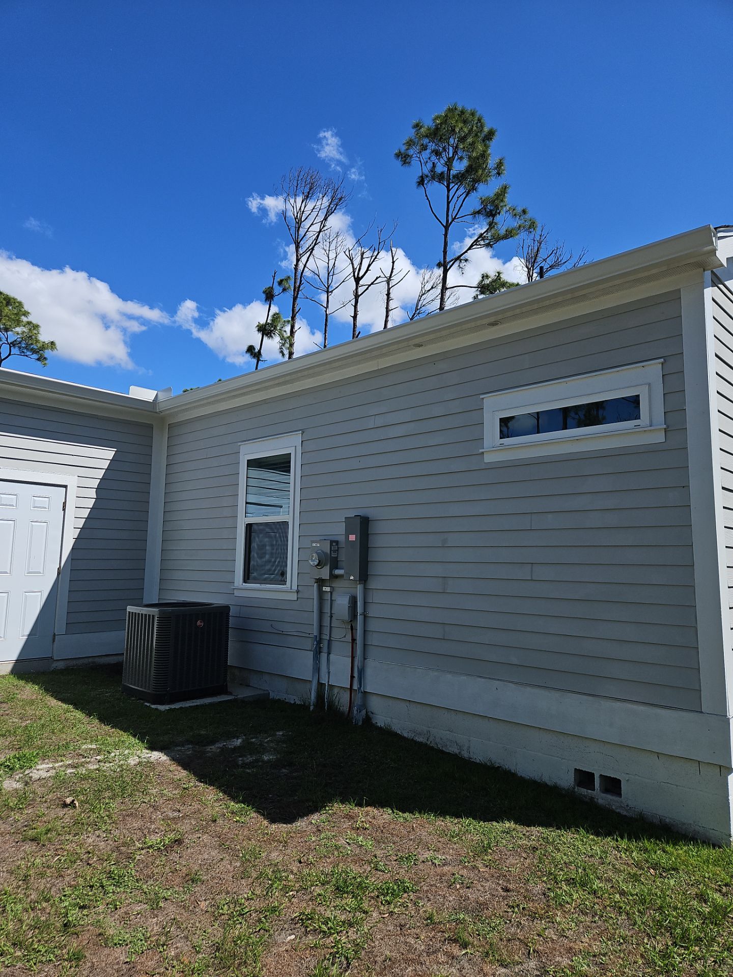 Downspout Installation using 3X4 Elbow Downspout in Port Charlotte FL by Gutter Professors