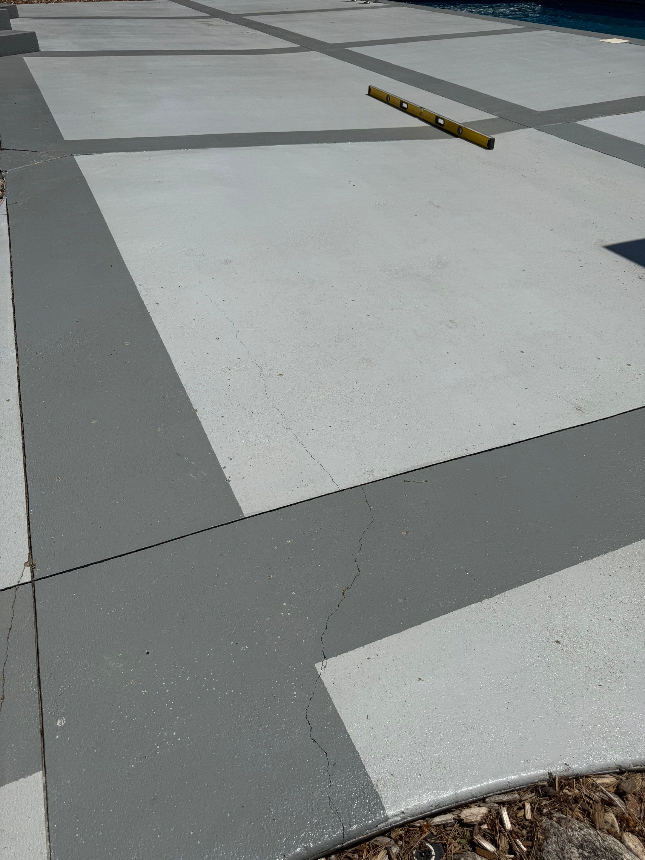 Decorative Concrete Pool Deck and Patio Resurfacing in Sioux Falls by Select Painting, Coatings & Garage Cabinets