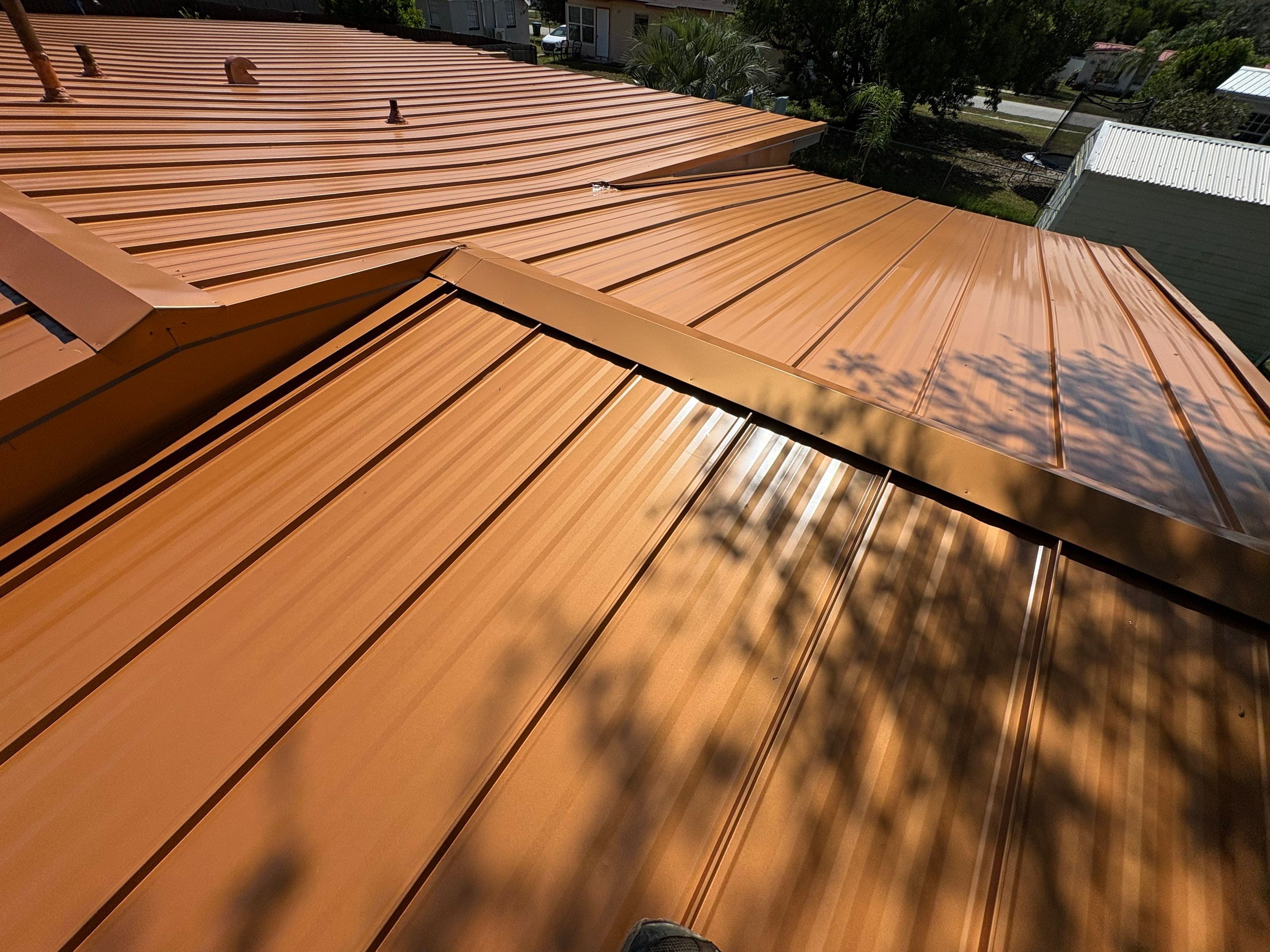 Standing Seam Metallic Copper Metal Roof Replacement in Deltona by Pinnacle Roofing Group