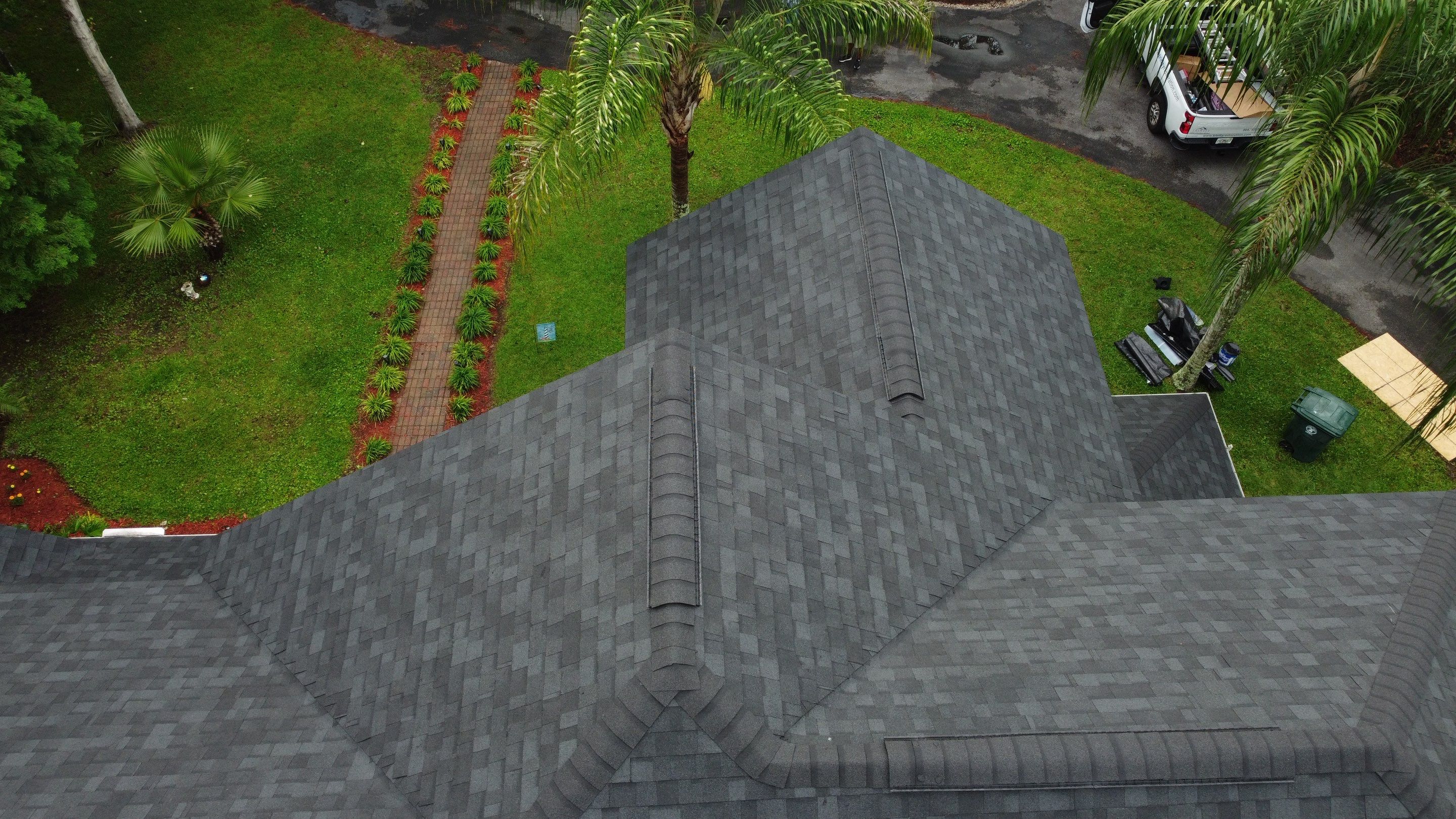 Complete Onyx Black Asphalt Shingle Roof Replacement and Skylight Installation in Jacksonville by Trinity Restoration and Roofing LLC