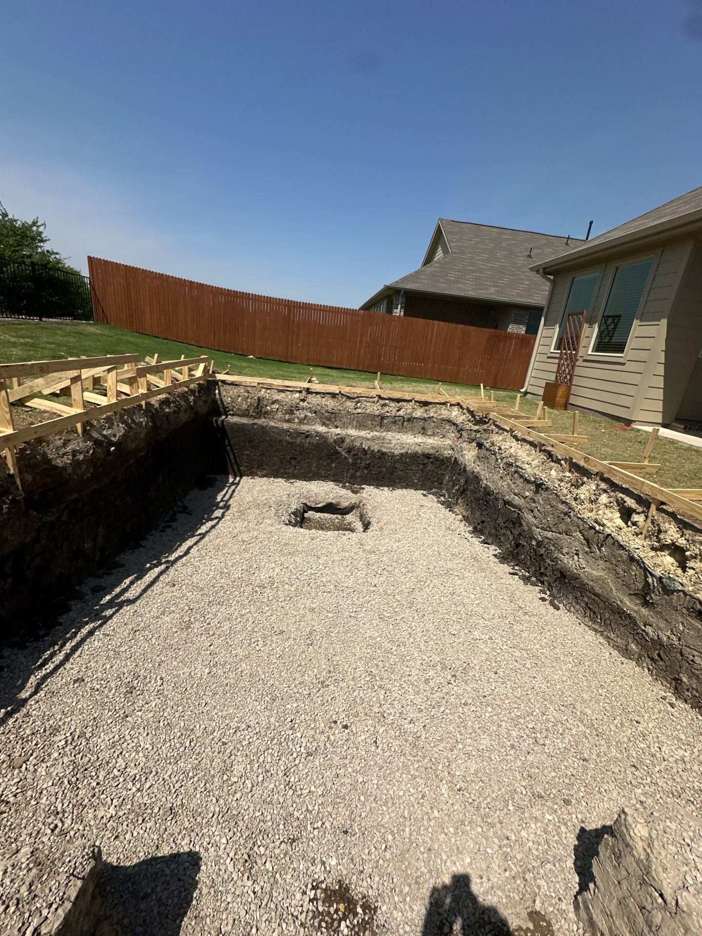 Sleek Geometric Pool with Crisp White Decking by Pinnacle Pools and Spas - DFW