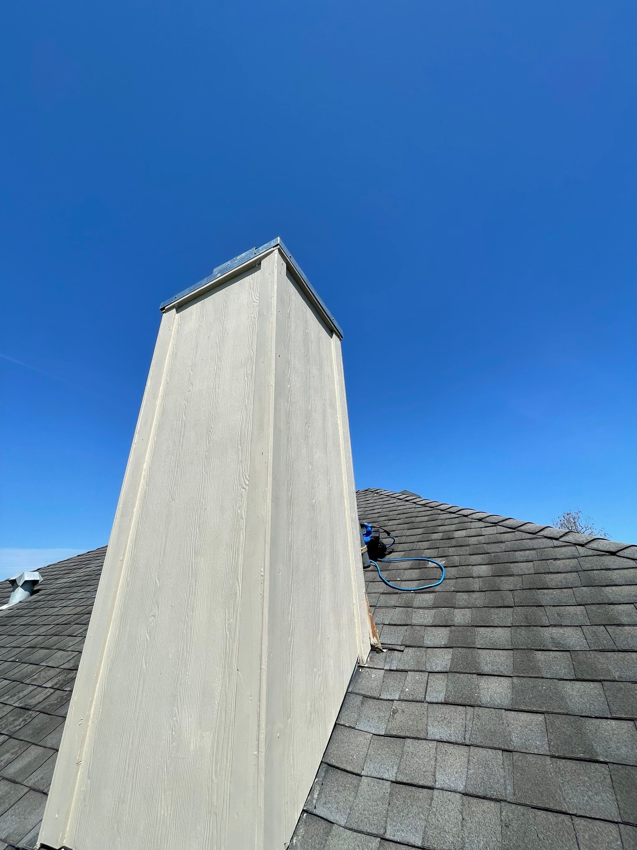 Residential Roofing Repair Replacing Chimney Cap by Lighthouse Roofing